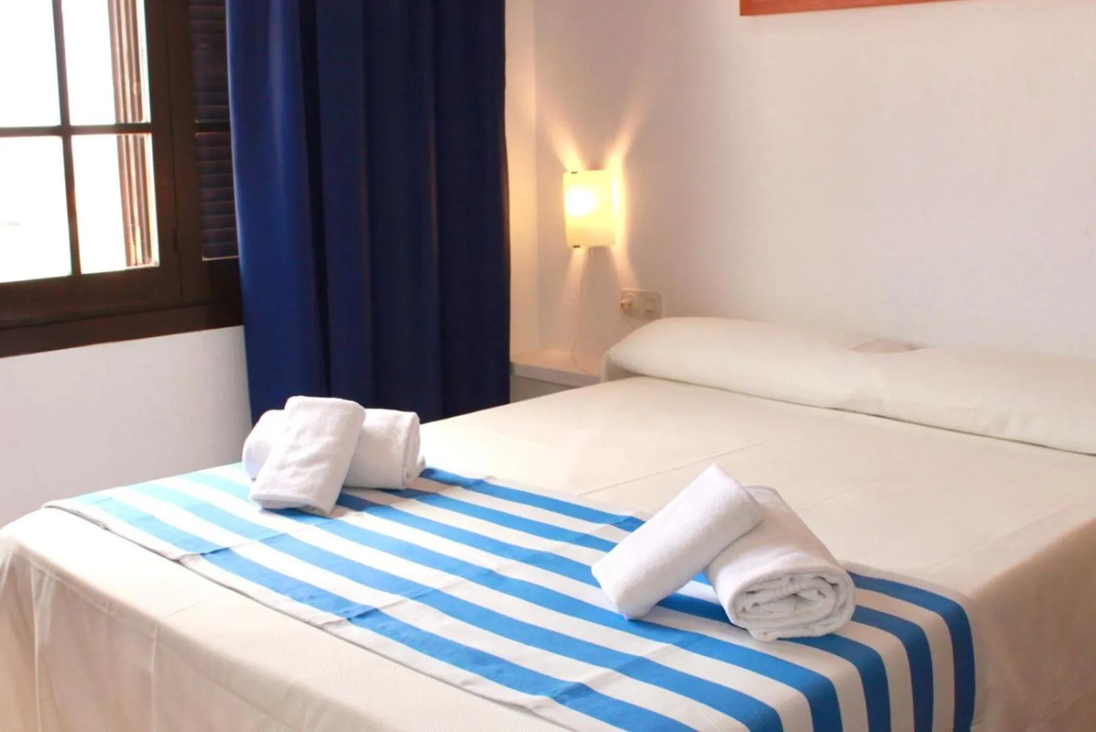 Bed in Apartamentos Posidonia