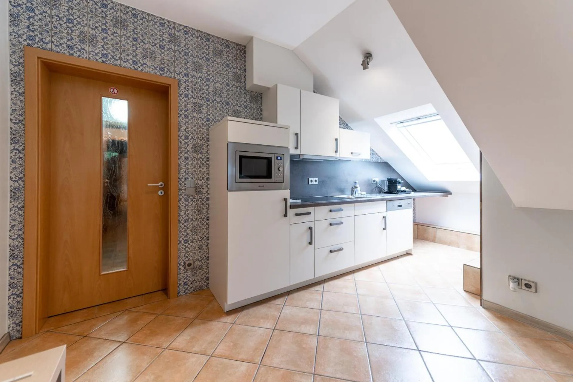 Kitchen or kitchenette in Appart-Hotel Gwendy