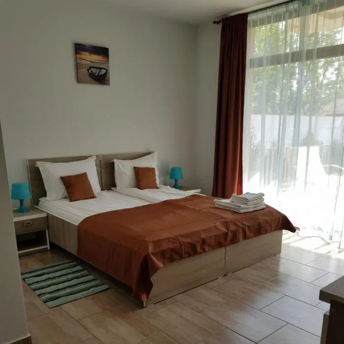 Bed in Sunny Family Vila Constanta