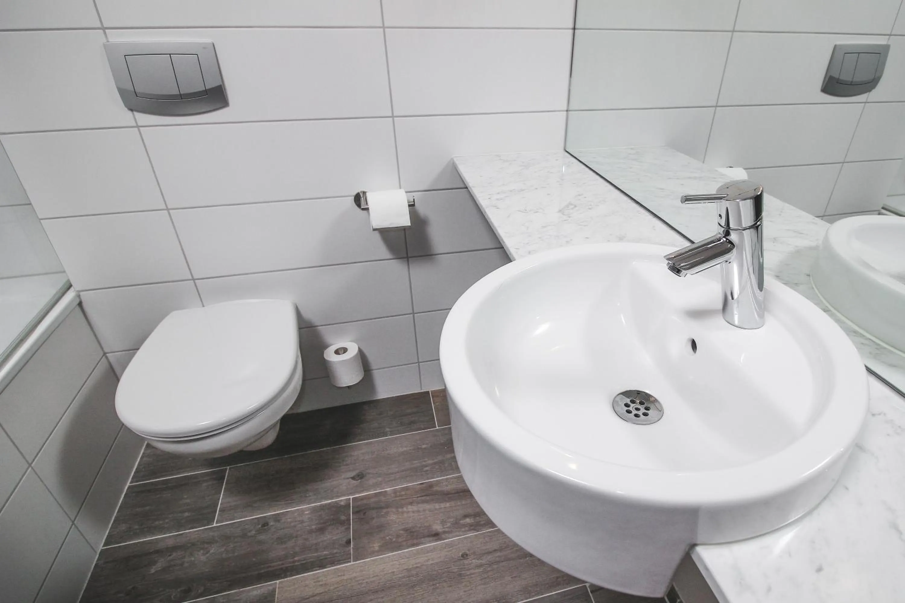 Bathroom in Bella Apartments & Rooms