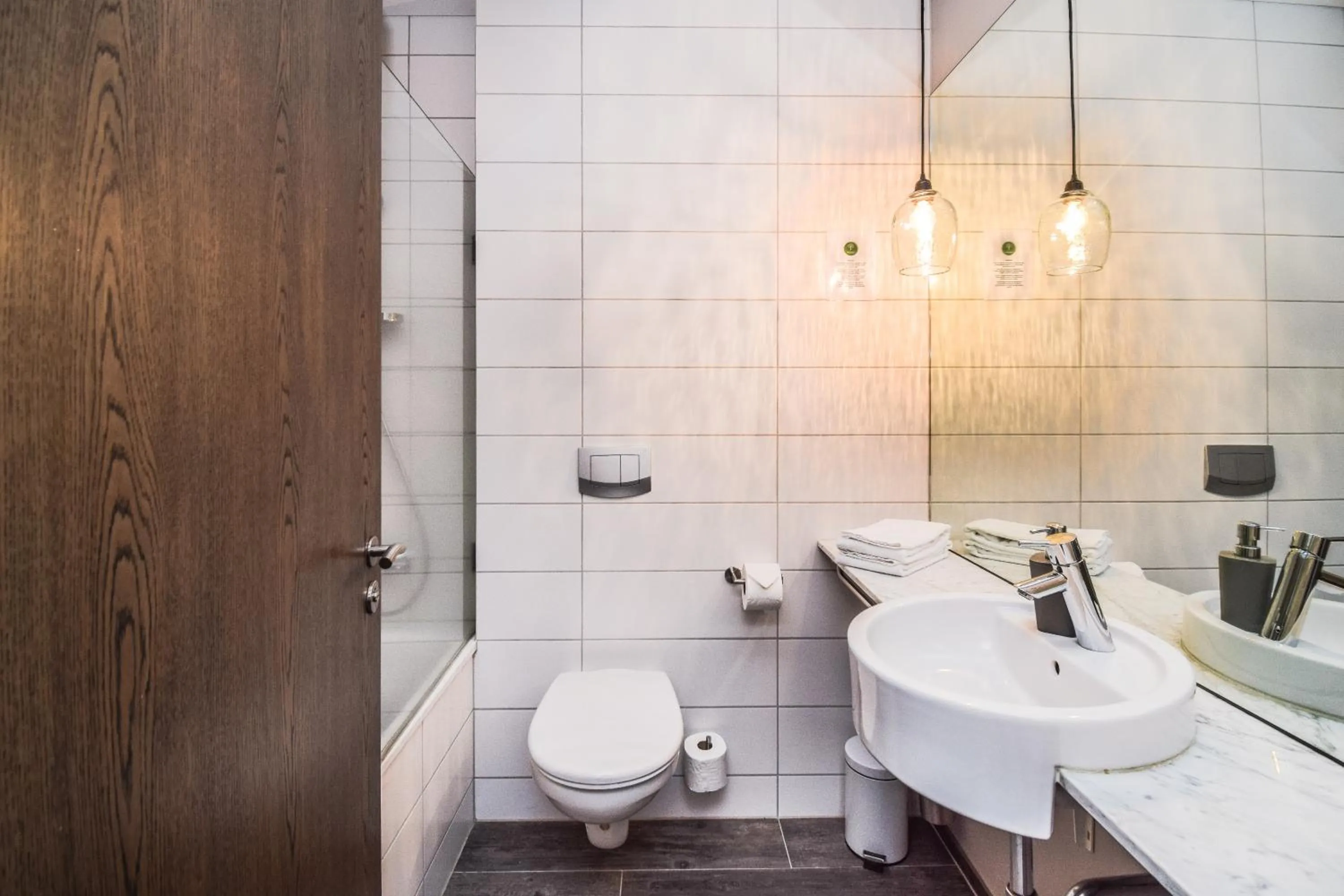 Bathroom in Bella Apartments & Rooms