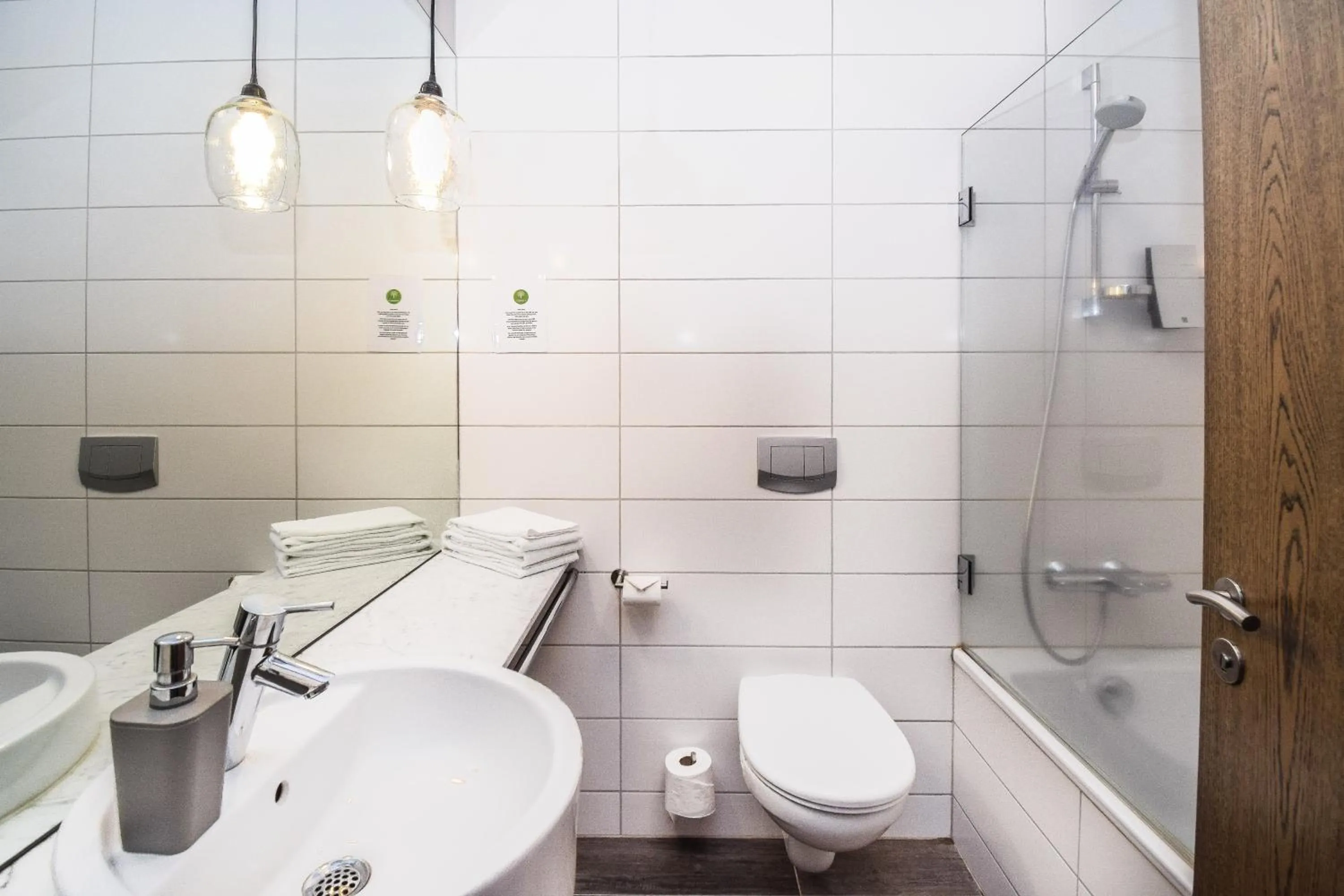 Bathroom in Bella Apartments & Rooms