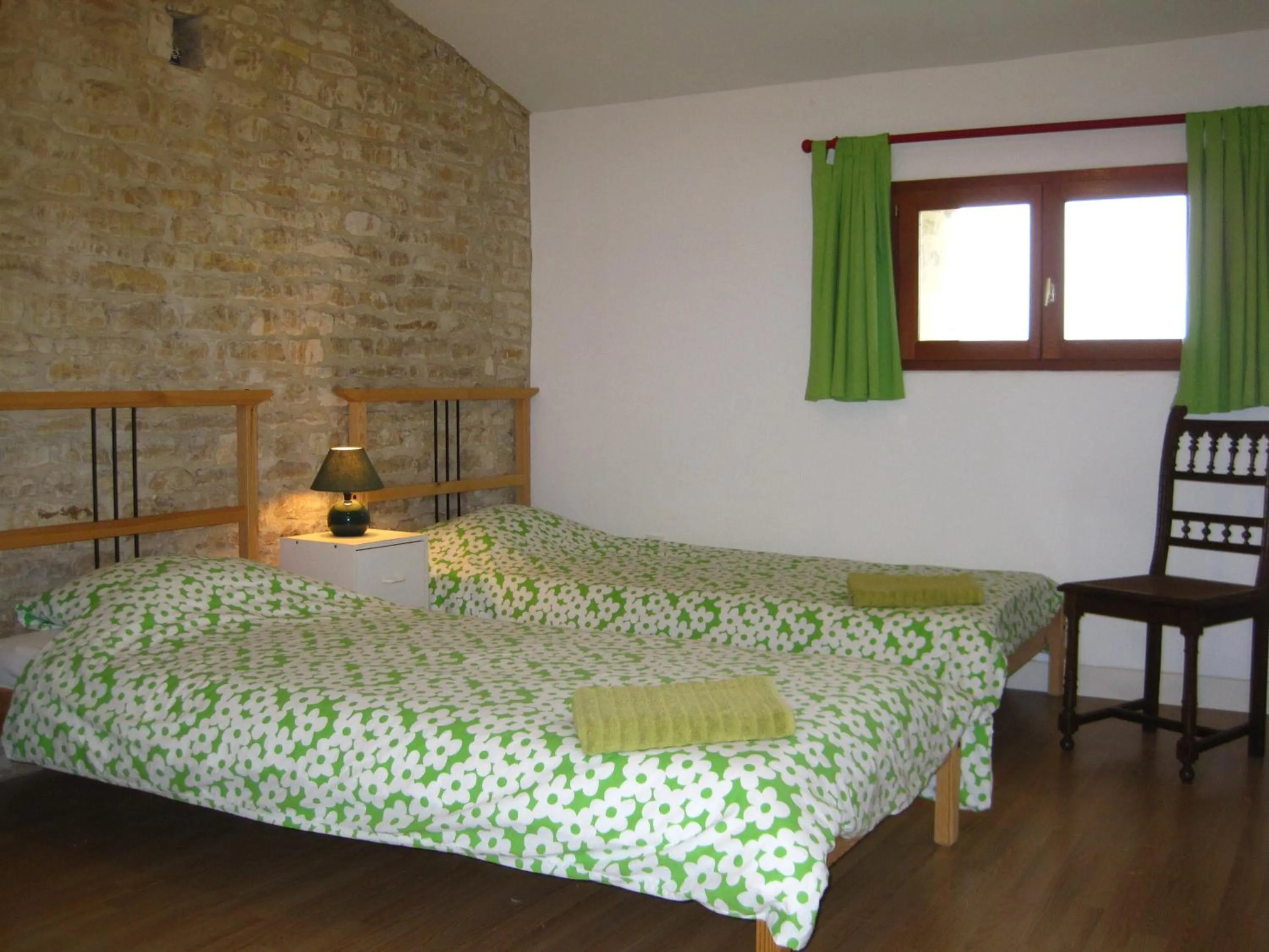 Bed in Le Noisetier at Les Hiboux Gites