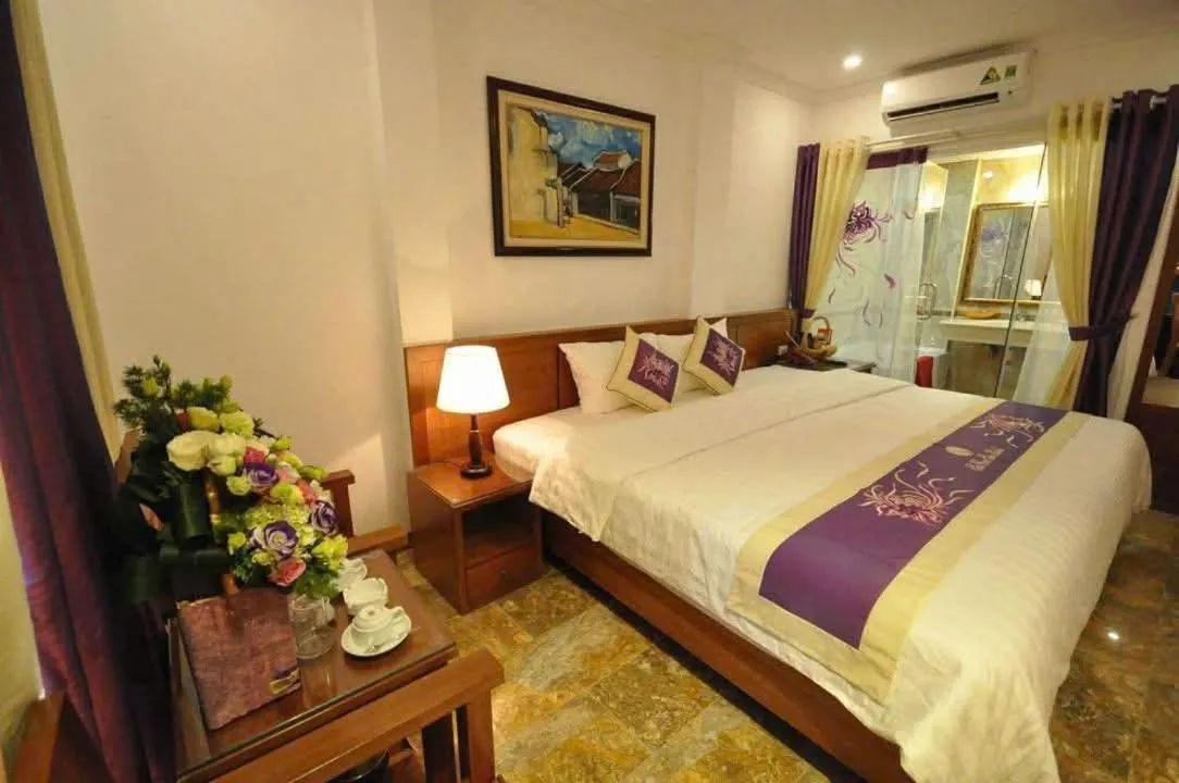 Photo of the whole room, Bed in SaiGon Sun Hotel