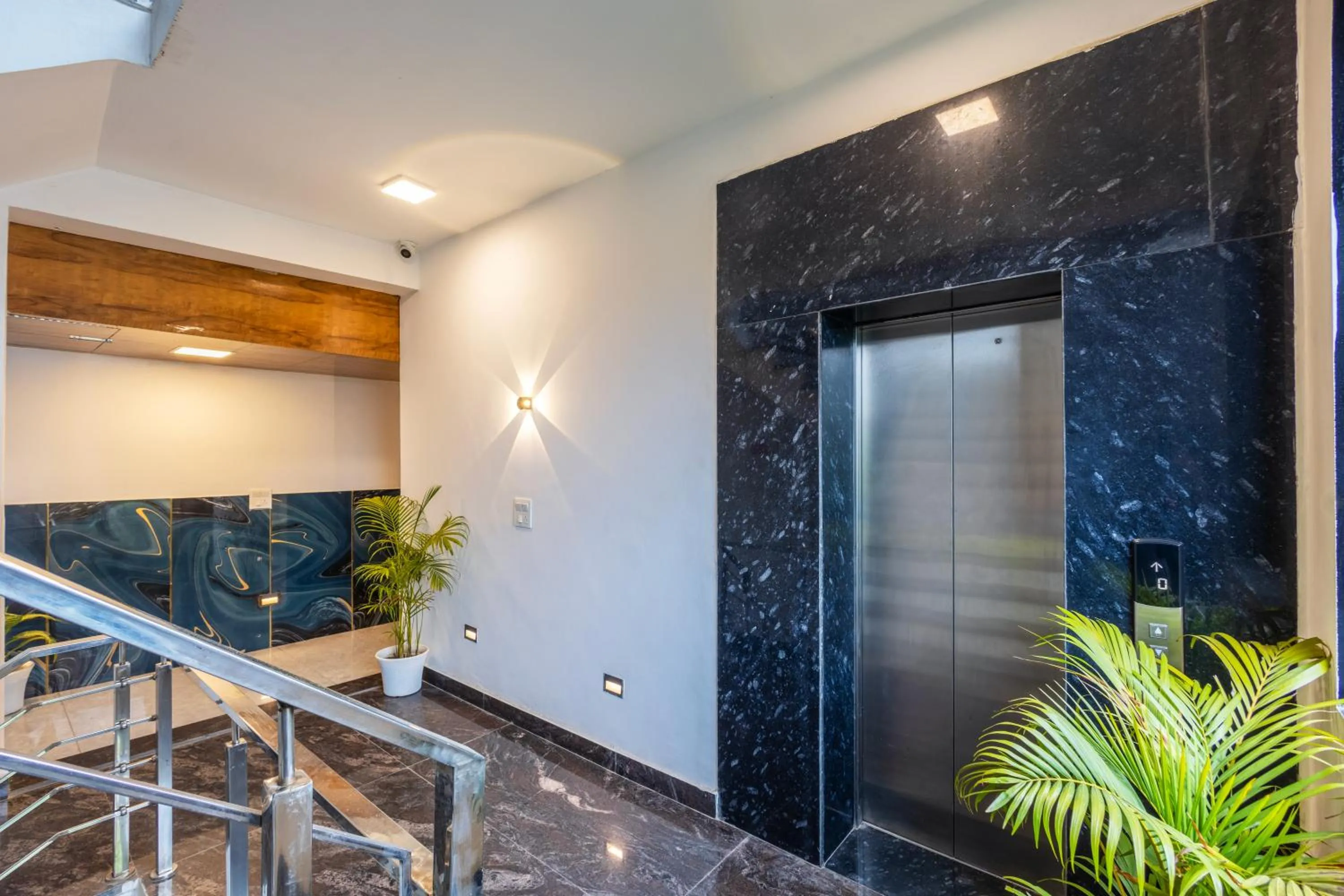 elevator in Hotel Admire Inn Sec - 104 By ASPL