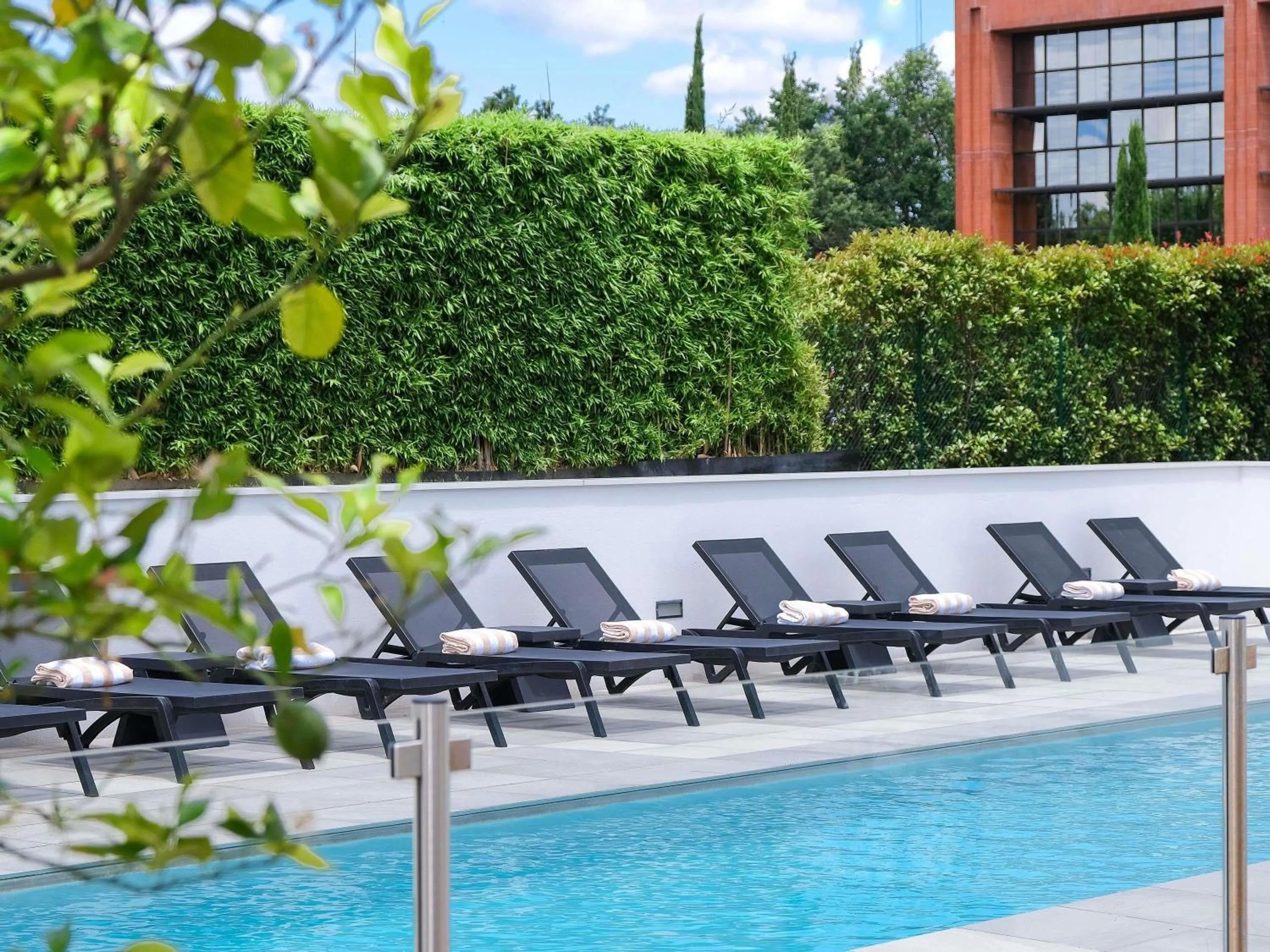 Pool view in Ibis Styles Toulouse Labège