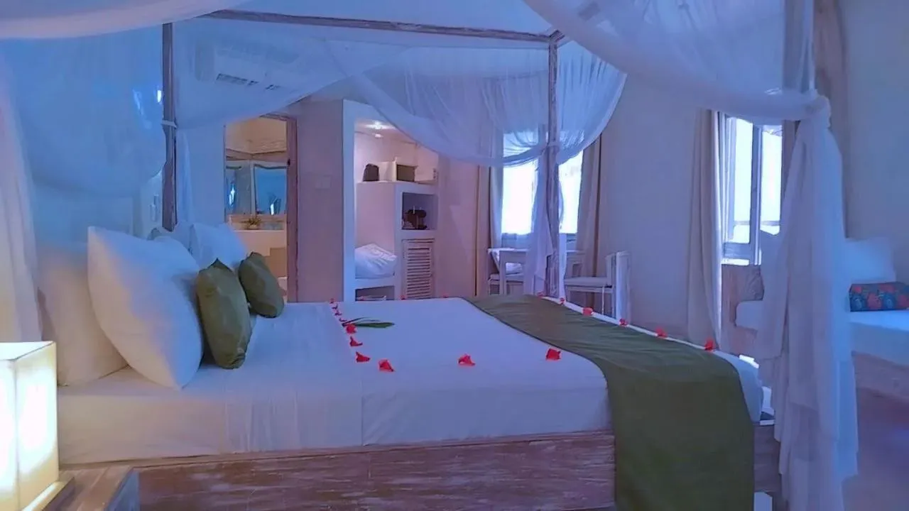 Bed in The Villa Luxury Suites Hotel