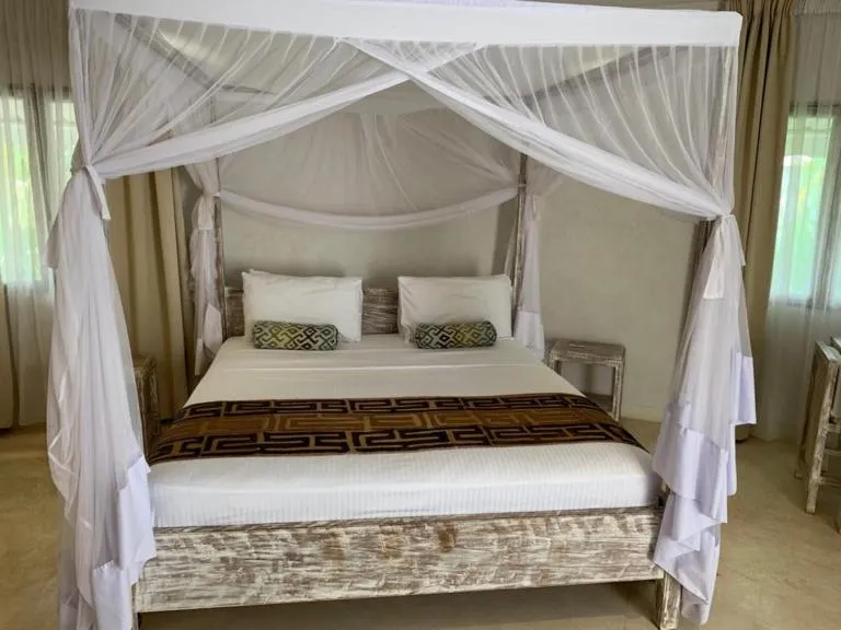 Bed in The Villa Luxury Suites Hotel