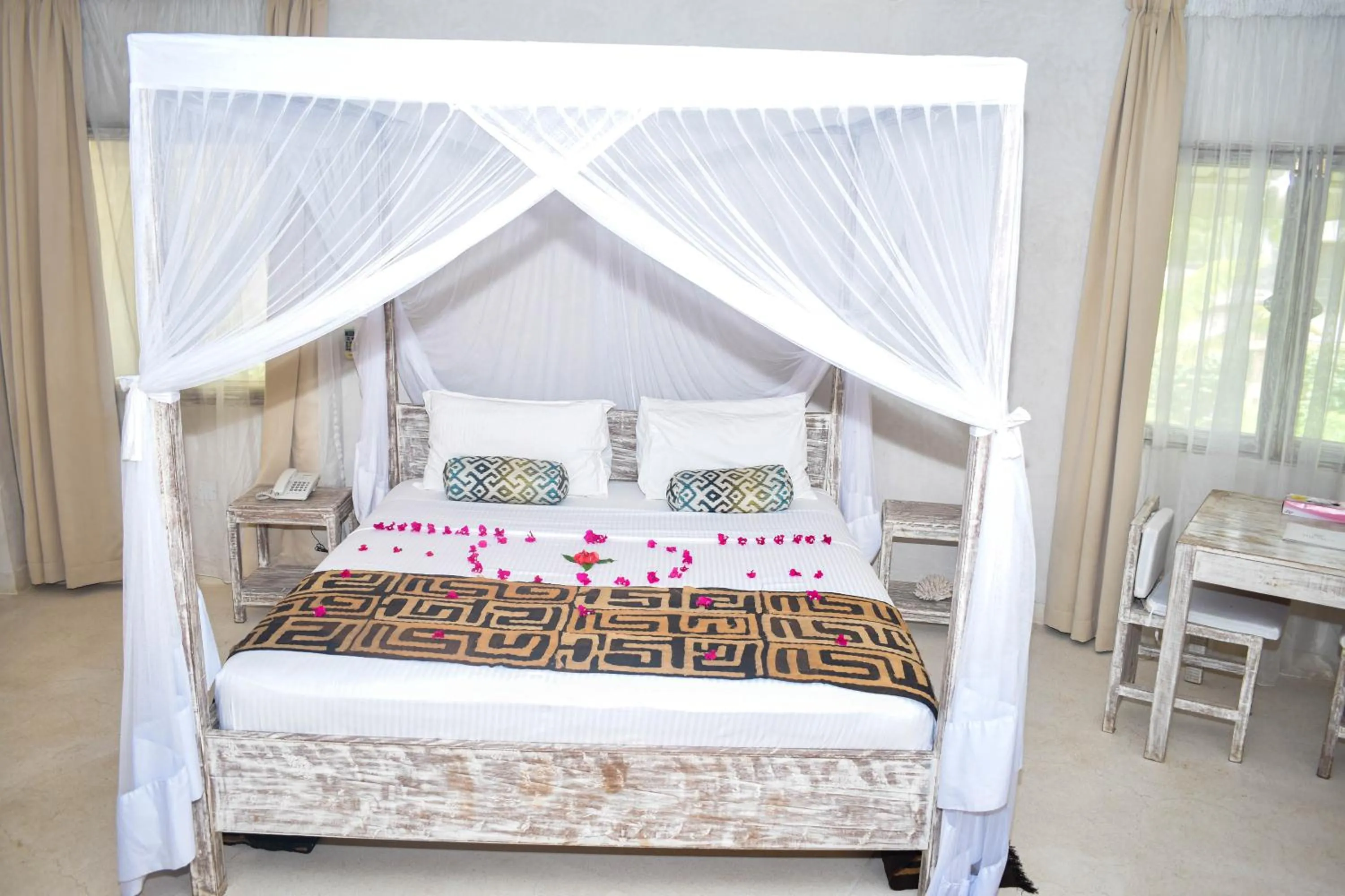 Bed in The Villa Luxury Suites Hotel