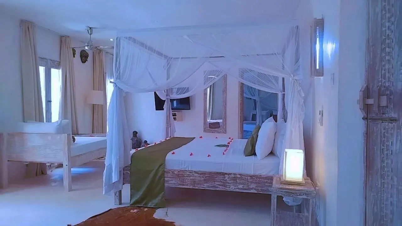 Bed in The Villa Luxury Suites Hotel