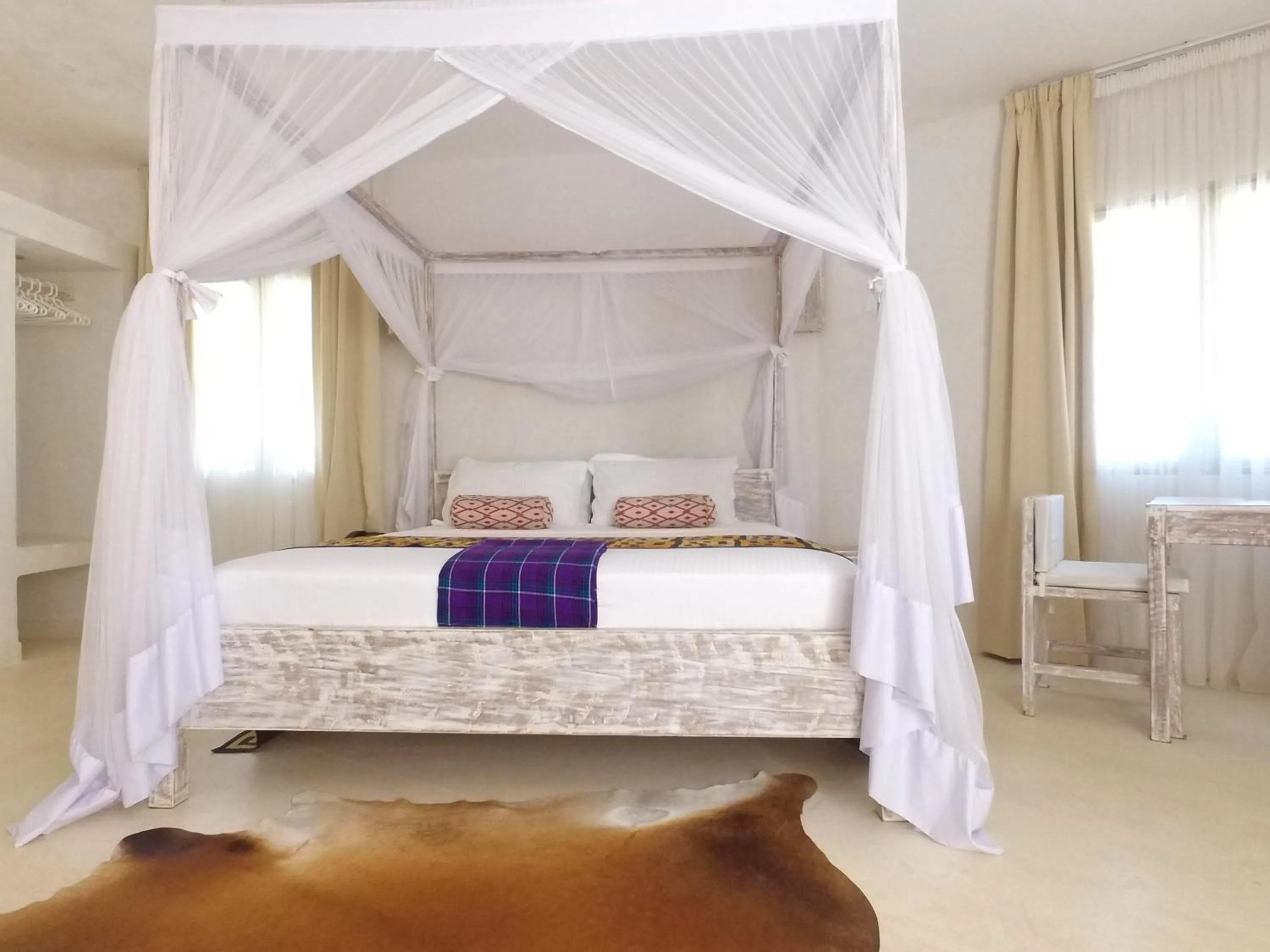 Bed in The Villa Luxury Suites Hotel