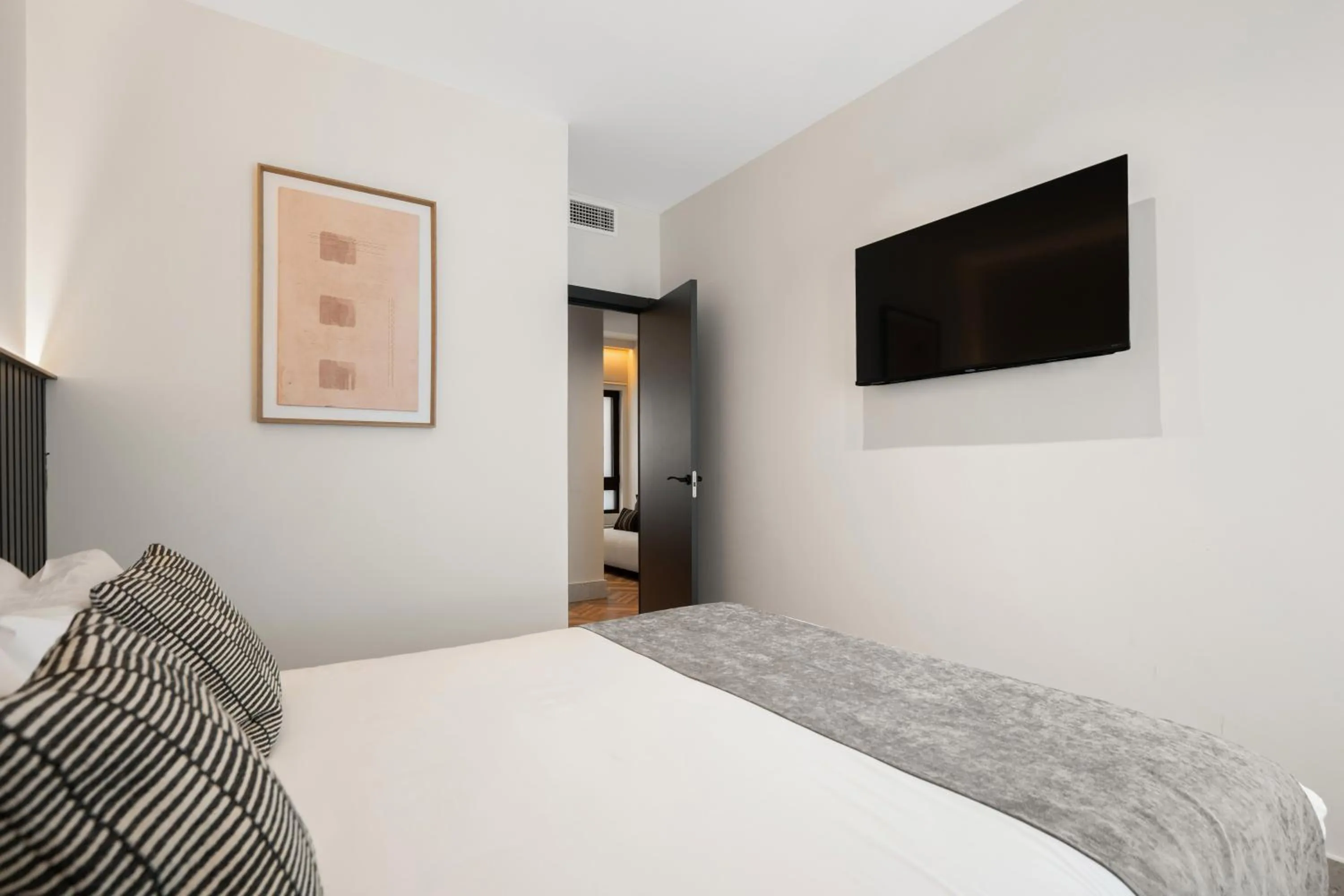 Bed in Pacifico Suites near Retiro