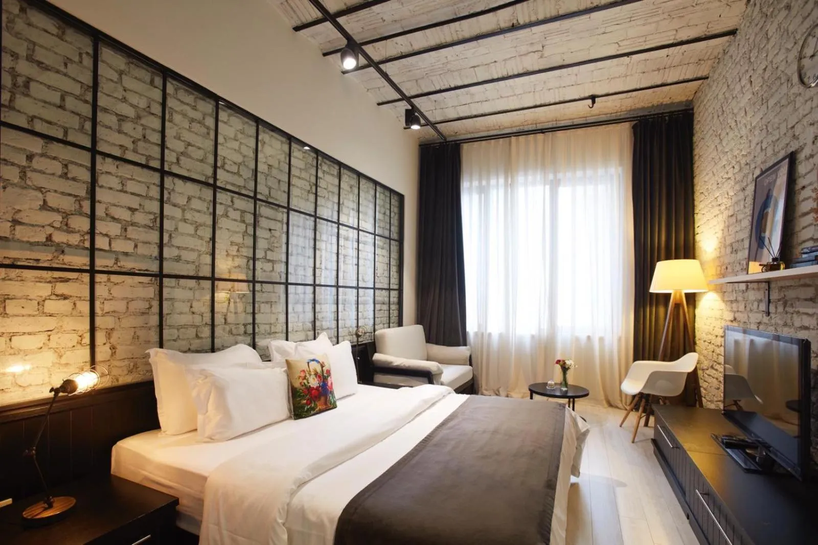 Photo of the whole room, Bed in Magnova Studios