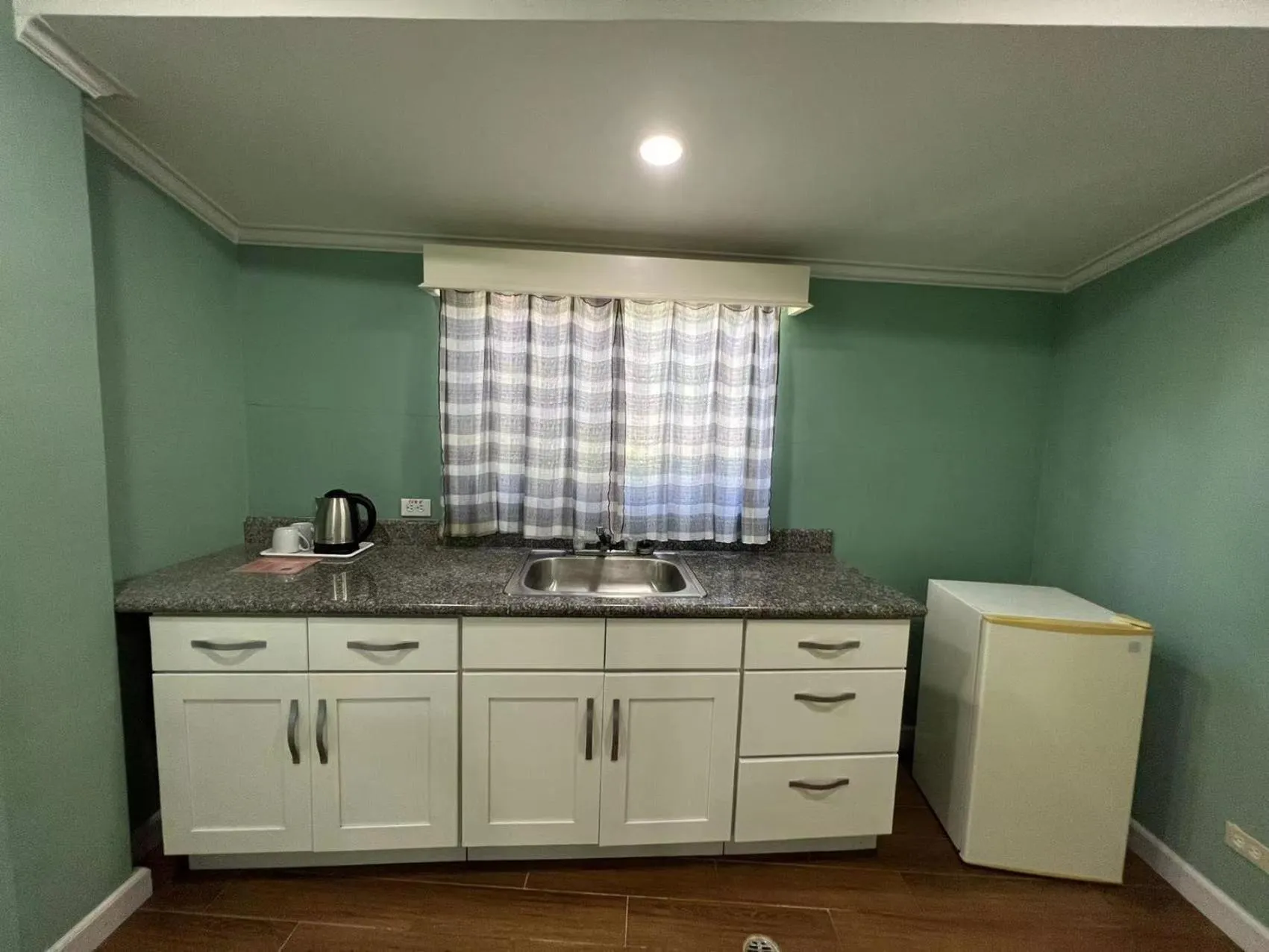 Kitchen or kitchenette in Beach Garden Hotel