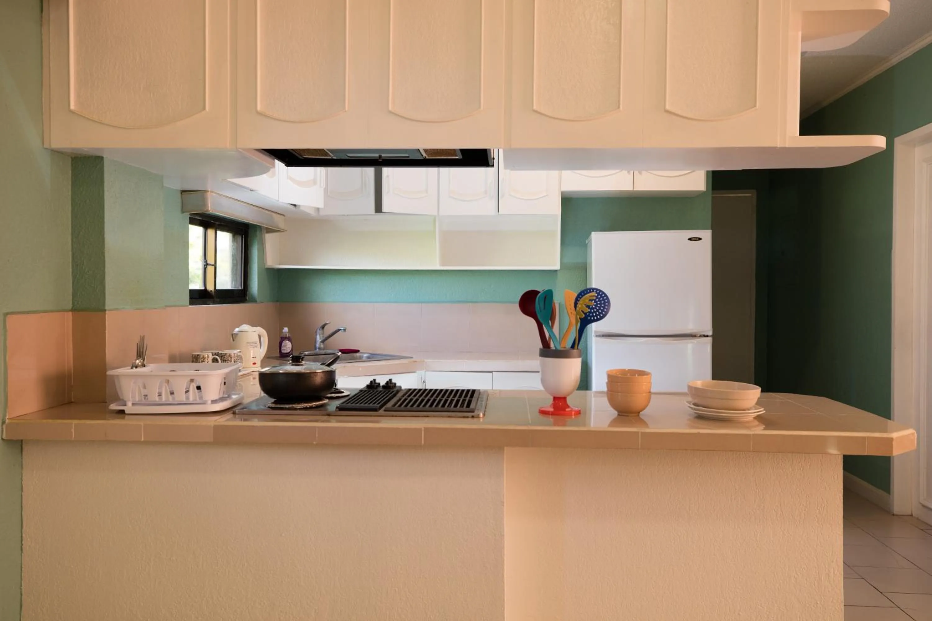 Kitchen or kitchenette in Beach Garden Hotel