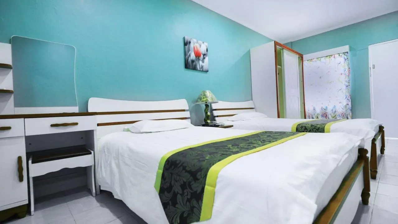 Bed in Beach Garden Hotel