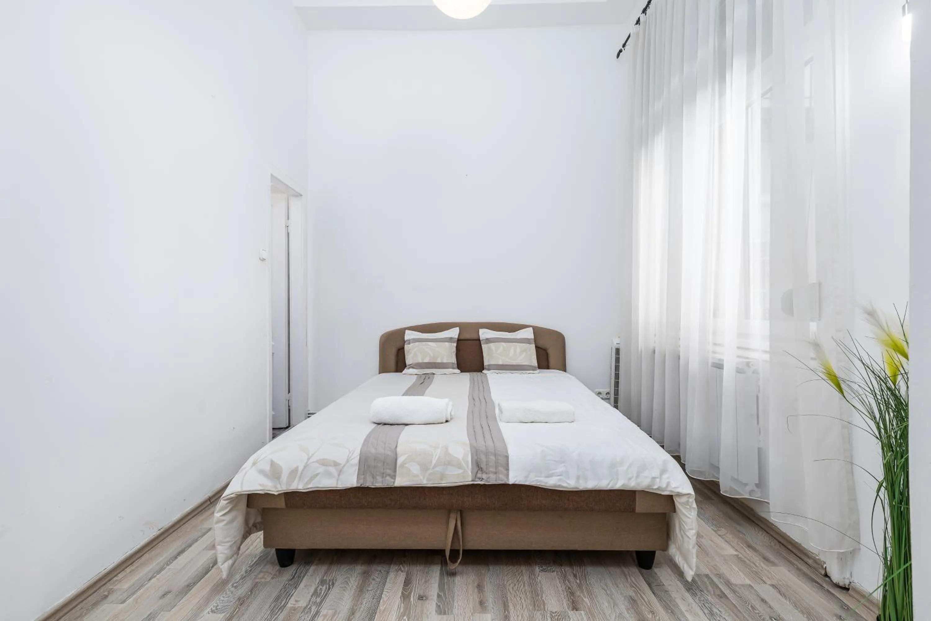 Bed in Real Apartments Lovag