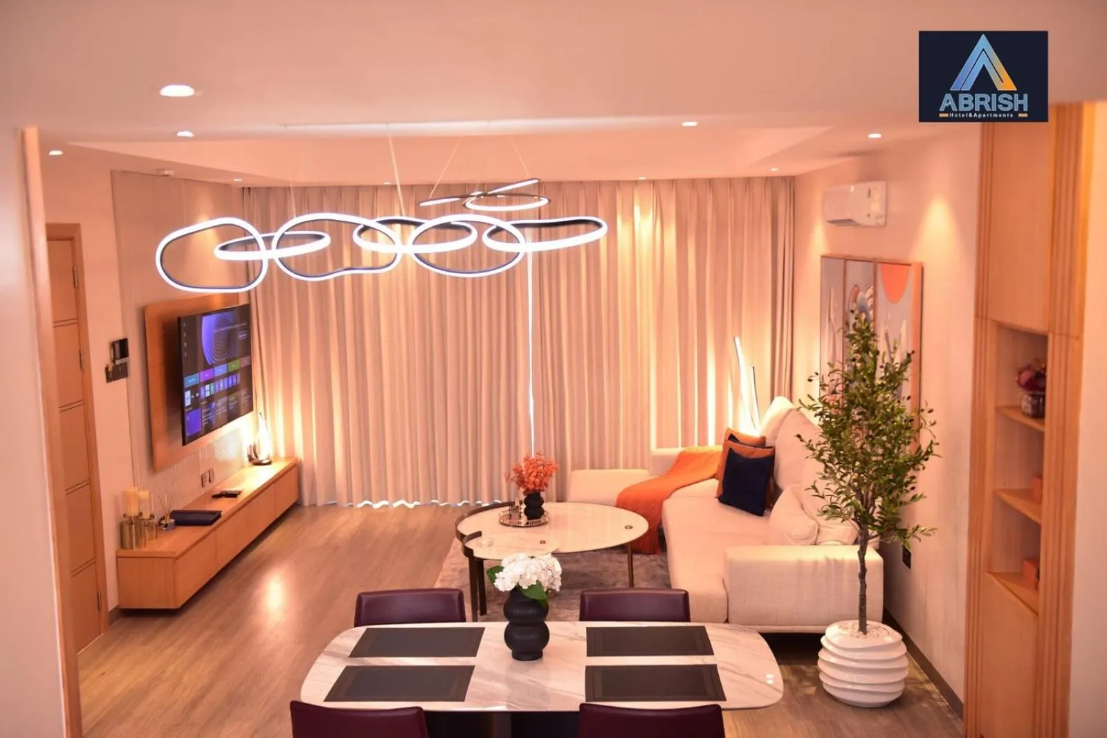 Communal lounge/ TV room in Abrish Hotel and Apartment