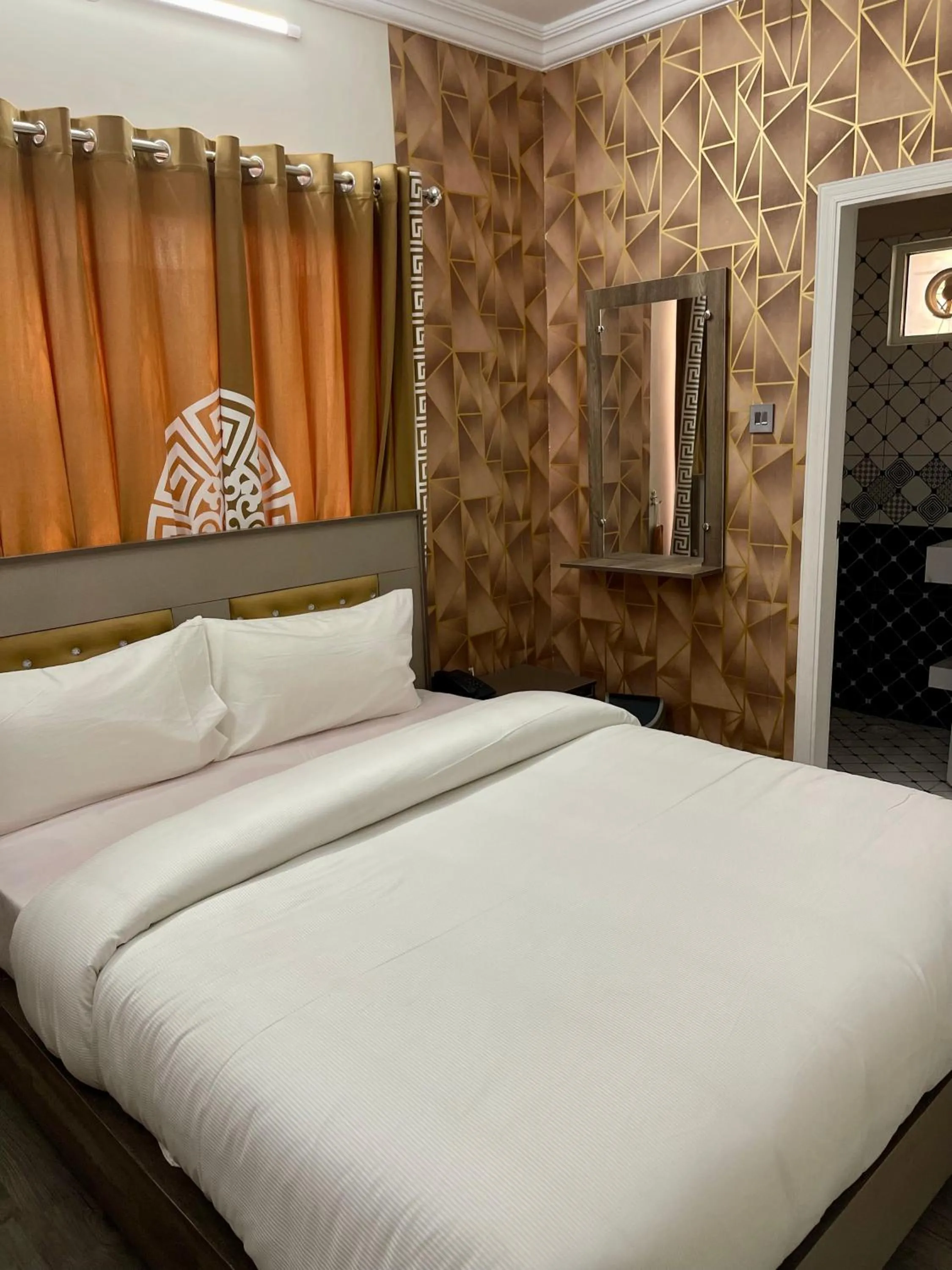 Bed in Landmark Guest House