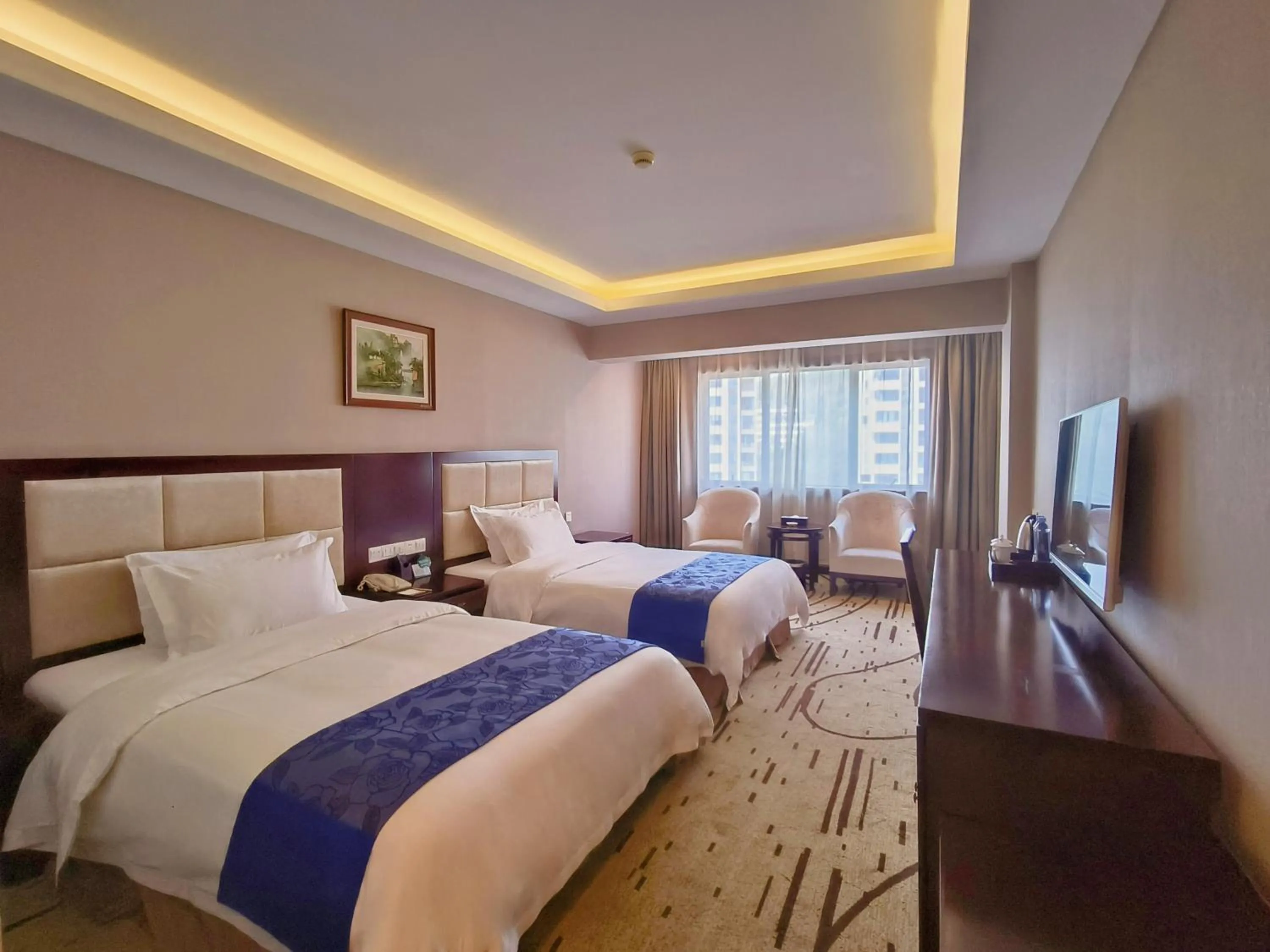 Communal lounge/ TV room, Bed in Zhangjiajie International Hotel