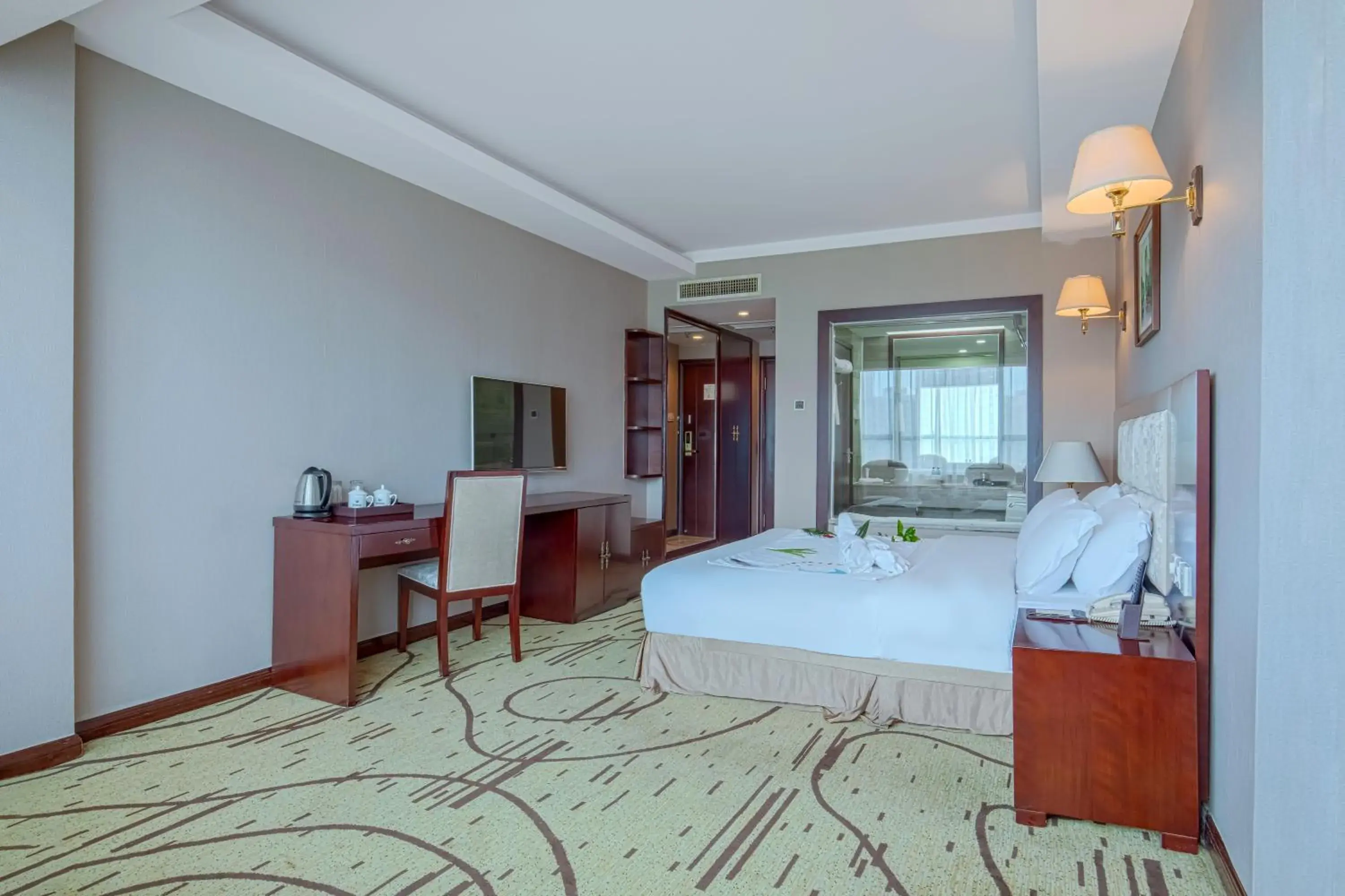 Communal lounge/ TV room, Bed in Zhangjiajie International Hotel Communal lounge/ TV room, Bed in Zhangjiajie International Hotel