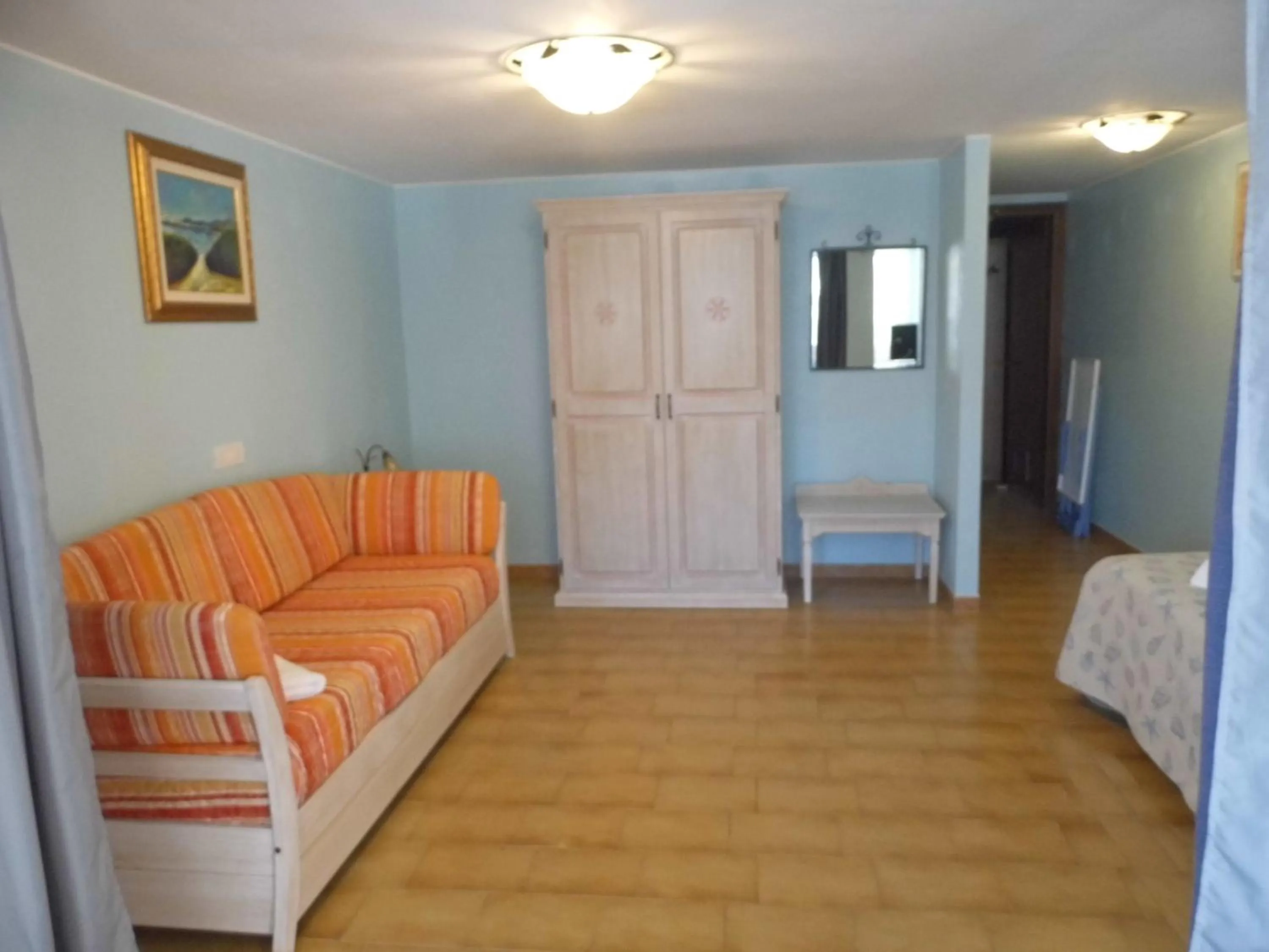 Communal lounge/ TV room in Le Nereidi Hotel & Residence