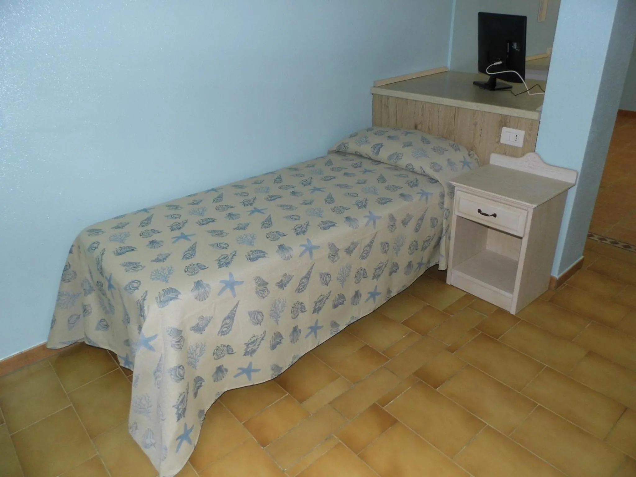 Bed in Le Nereidi Hotel & Residence