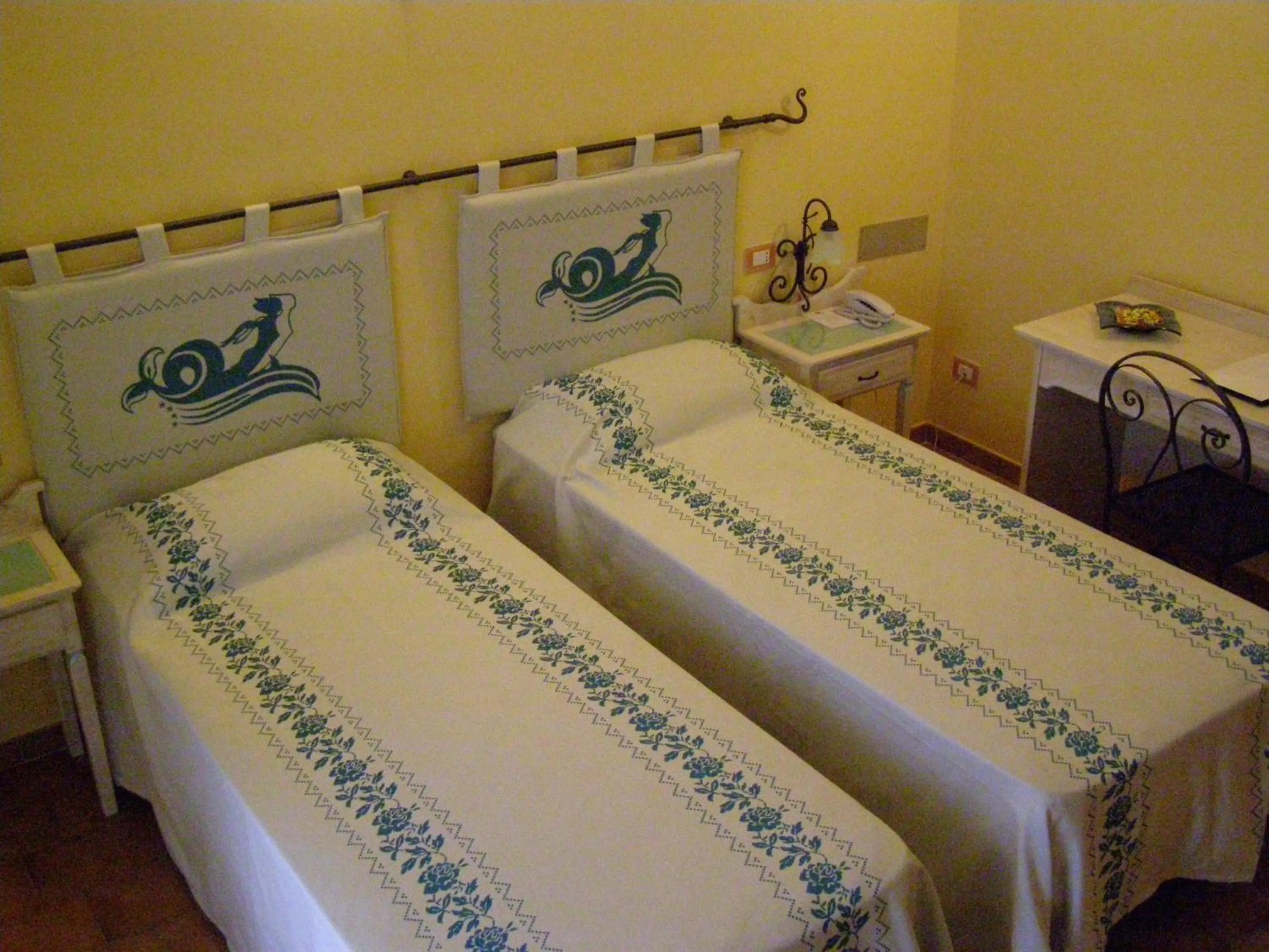 Bed in Le Nereidi Hotel & Residence