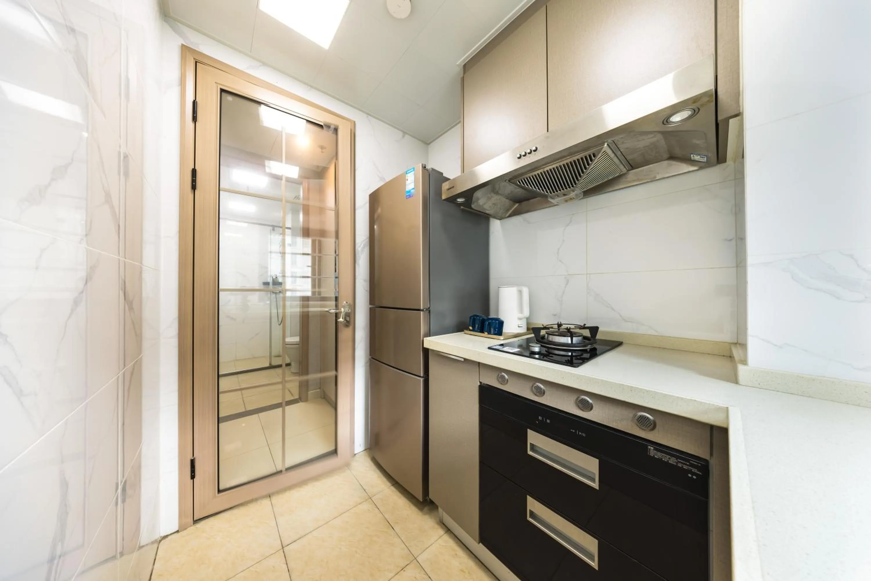 Kitchen or kitchenette in Kingkey Shuibei International Apartment Hotel