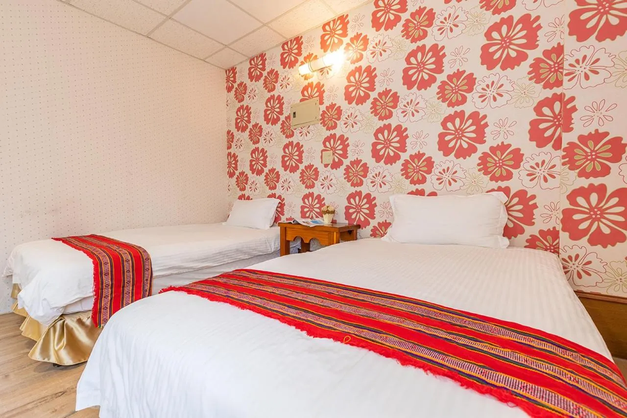 Bed in Yishin Garden B&B