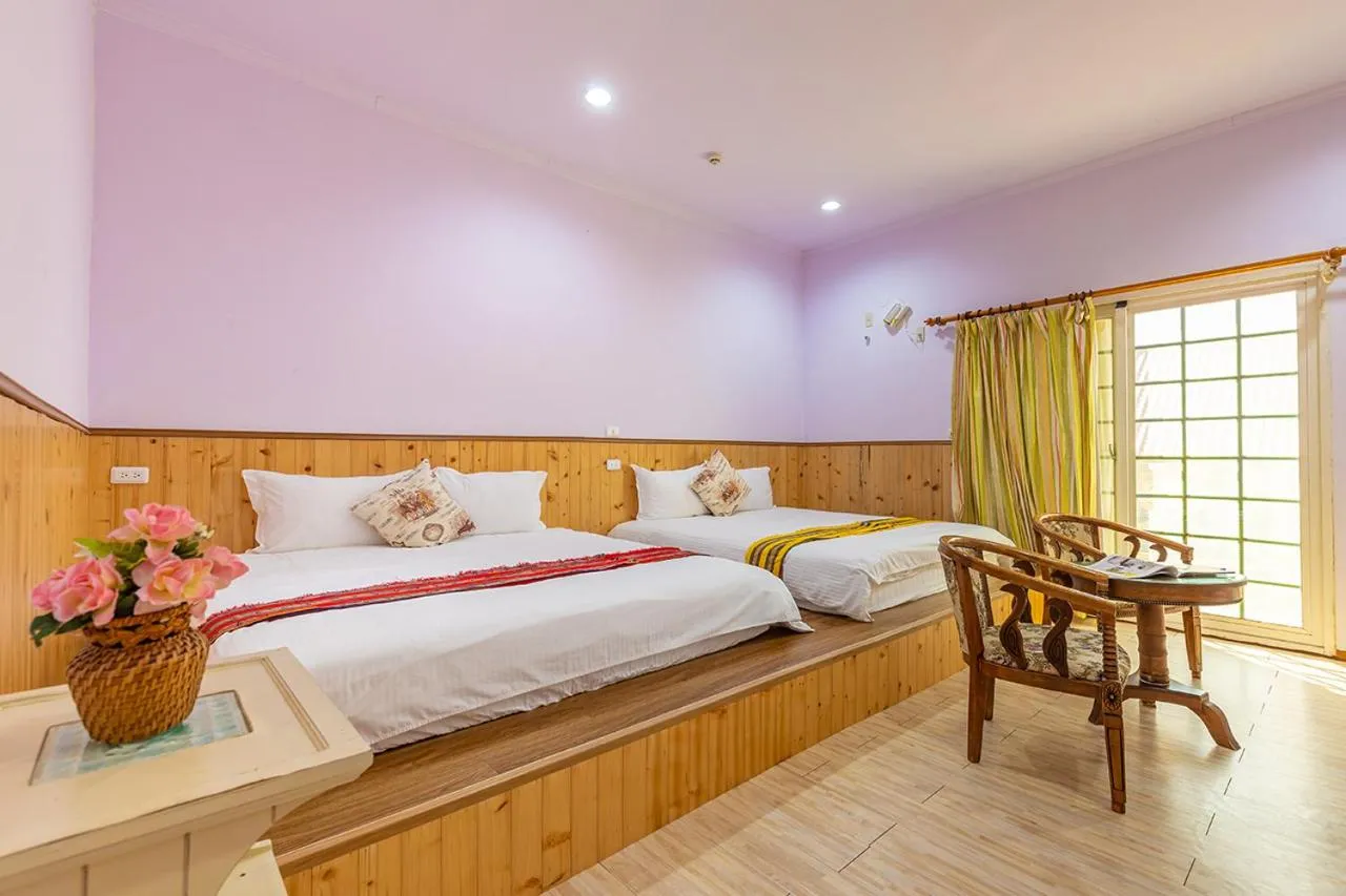 Bed in Yishin Garden B&B