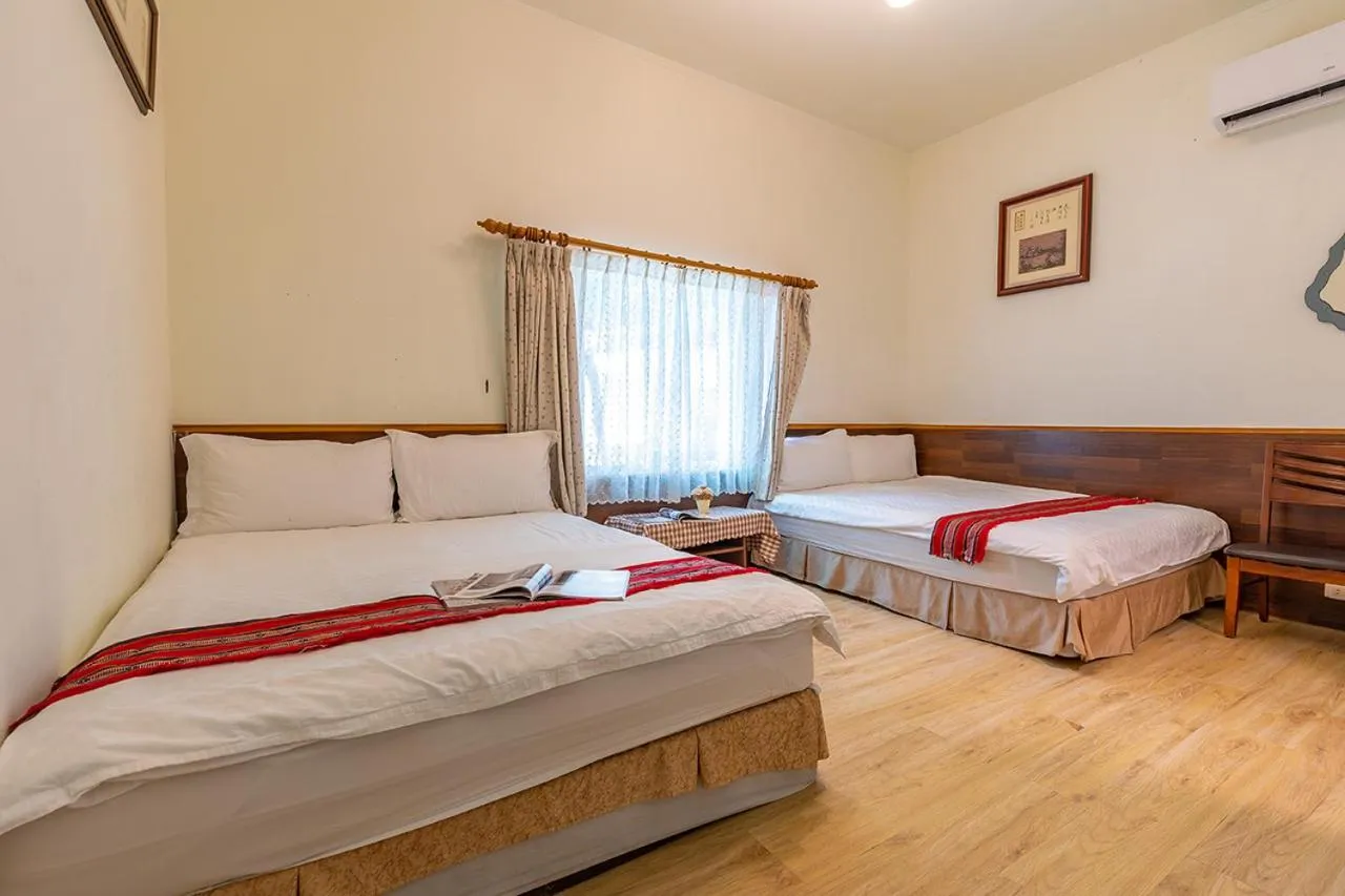 Bed in Yishin Garden B&B