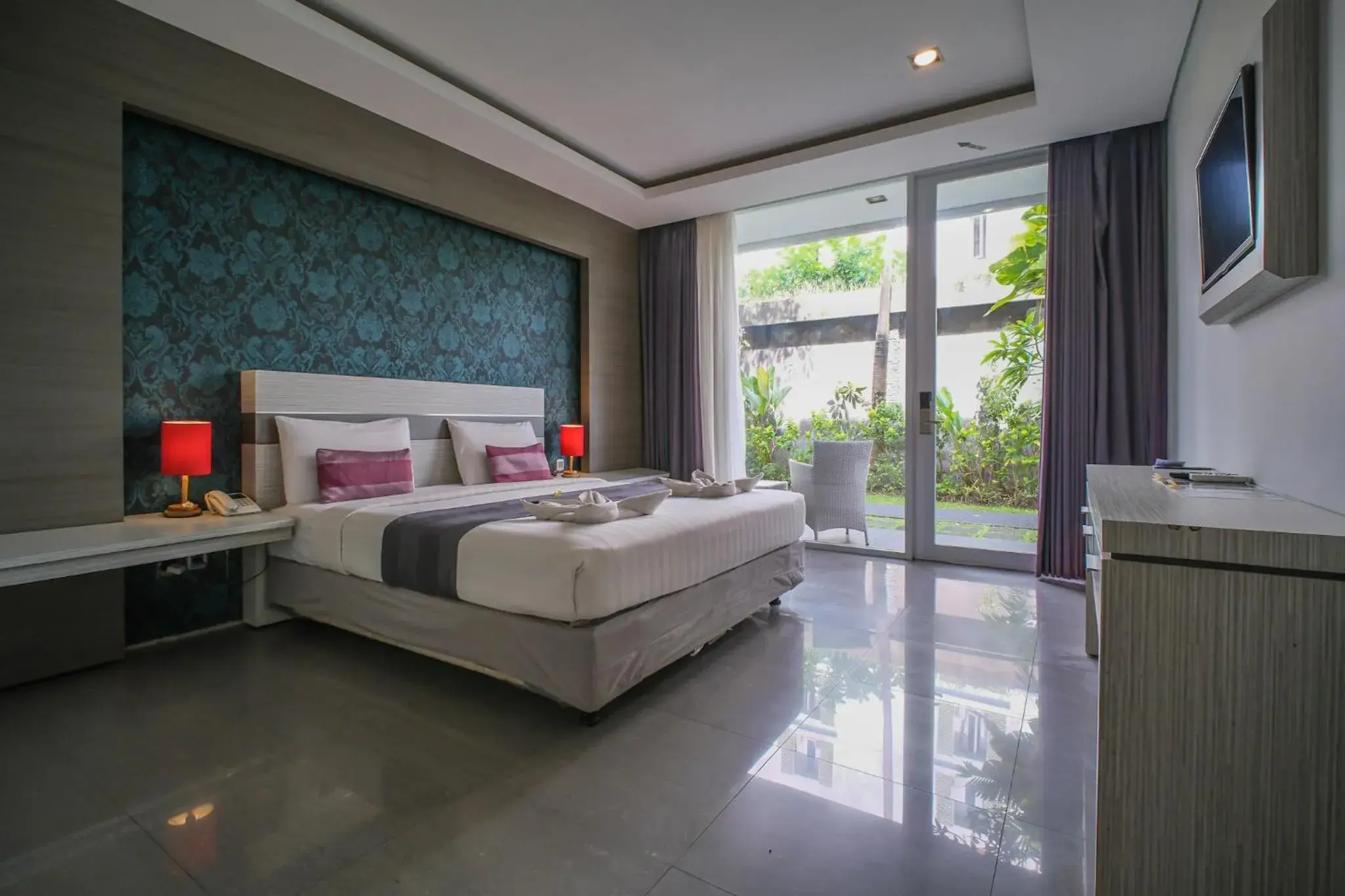 Bed in Kamini Legian Hotel Bed in Kamini Legian Hotel