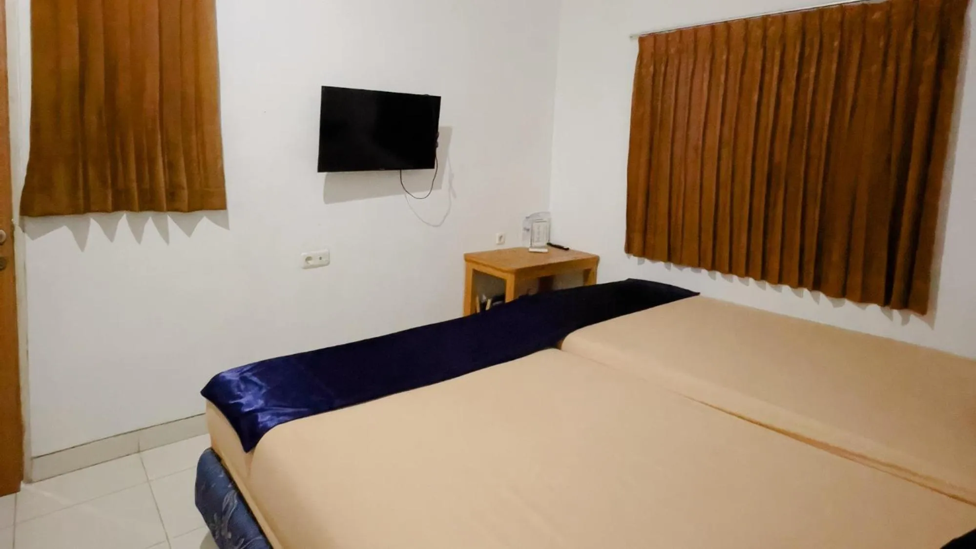 Bed in NamRoom at Tomang