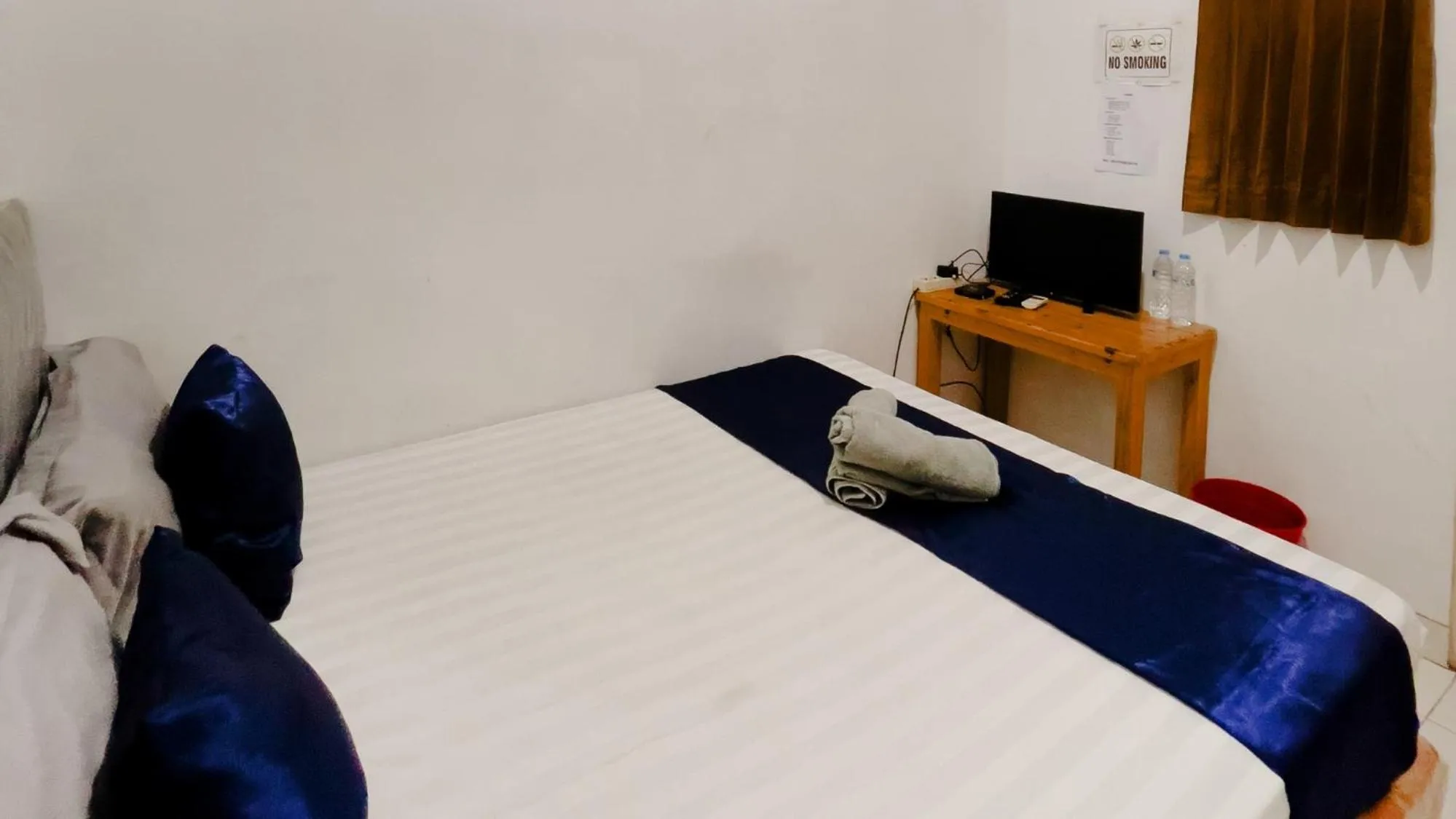 Bed in NamRoom at Tomang