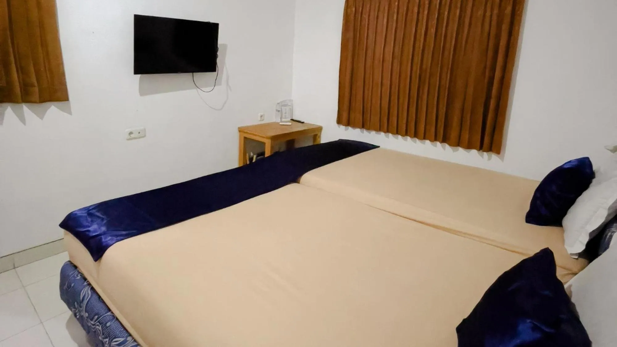 Bed in NamRoom at Tomang