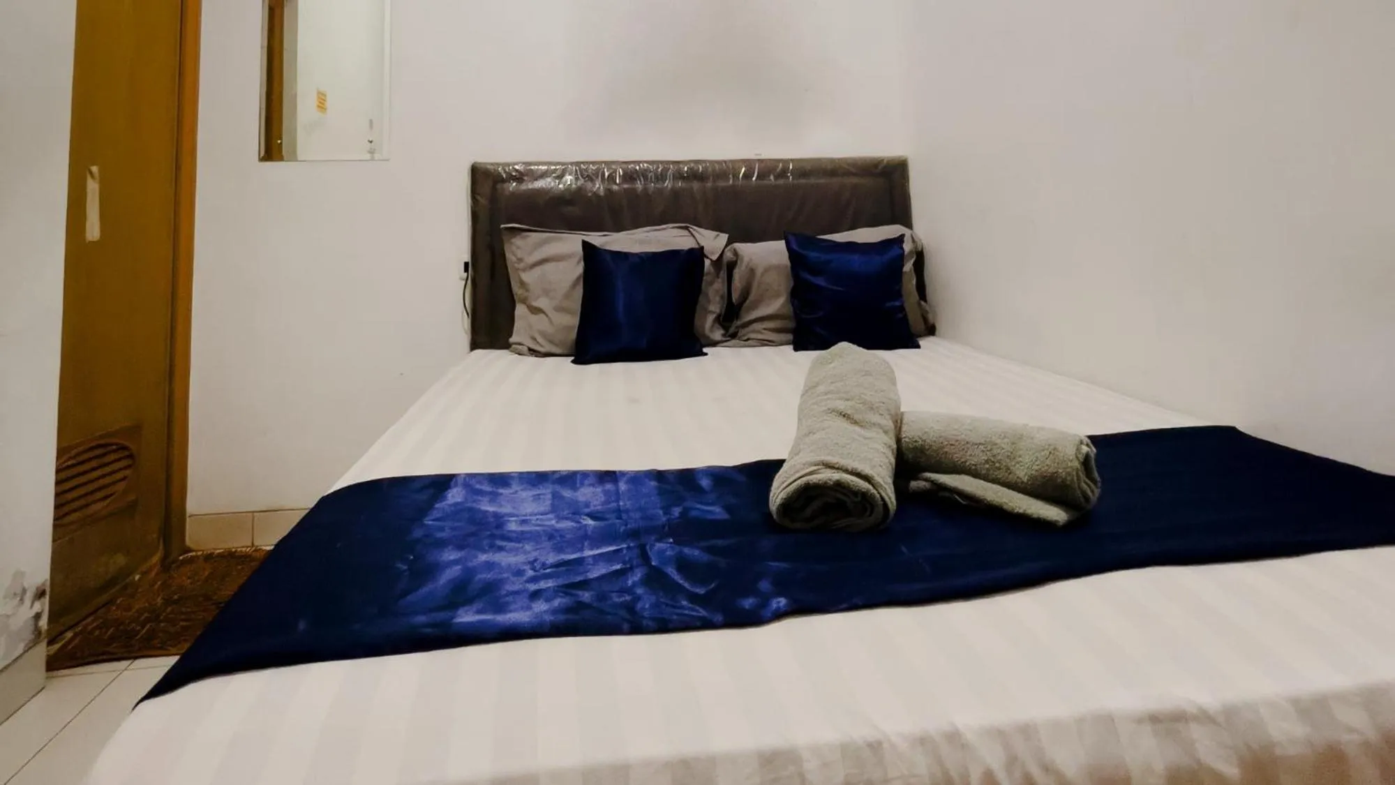 Bed in NamRoom at Tomang