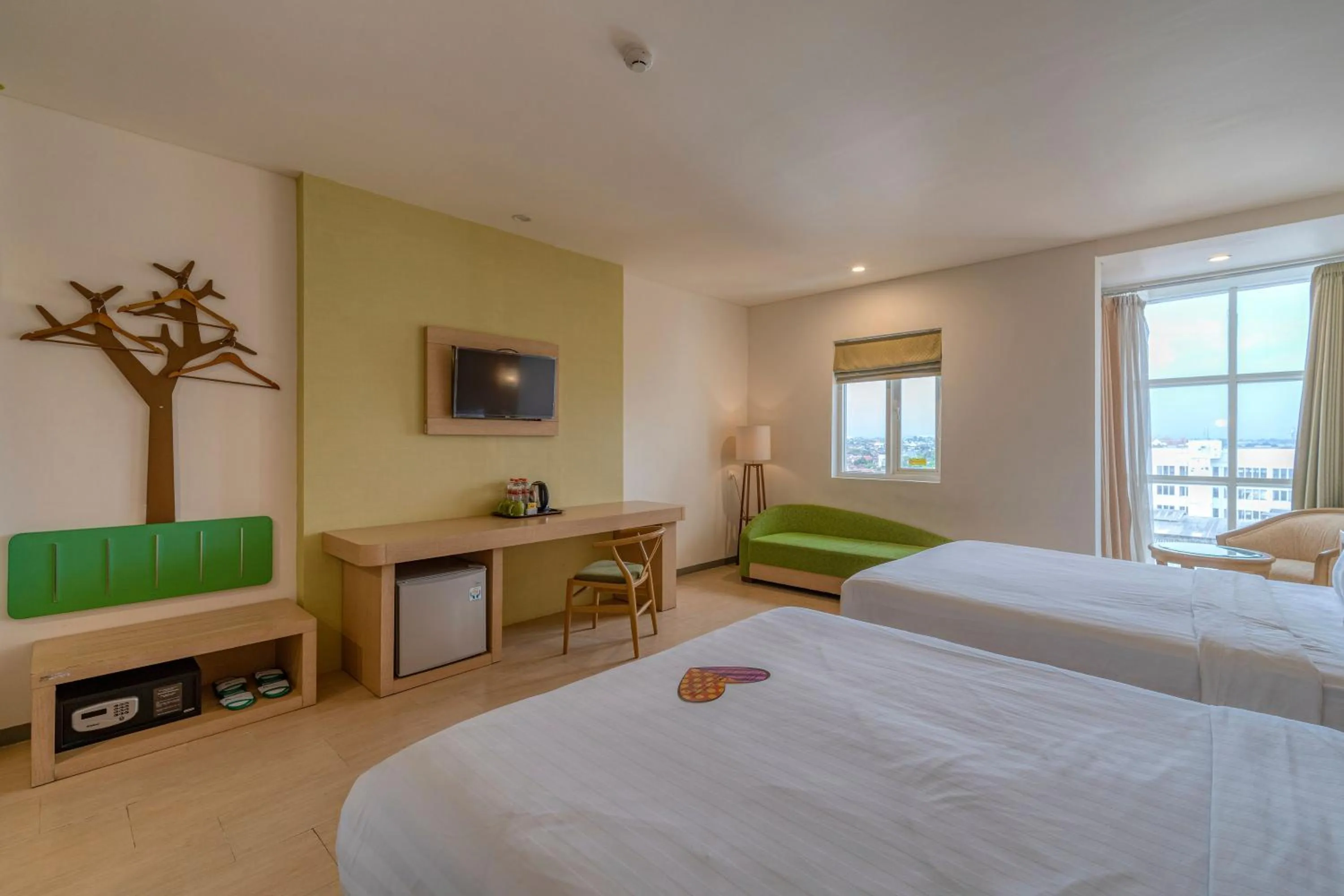 Photo of the whole room, Bed in Ascent Hotel & Cafe Malang