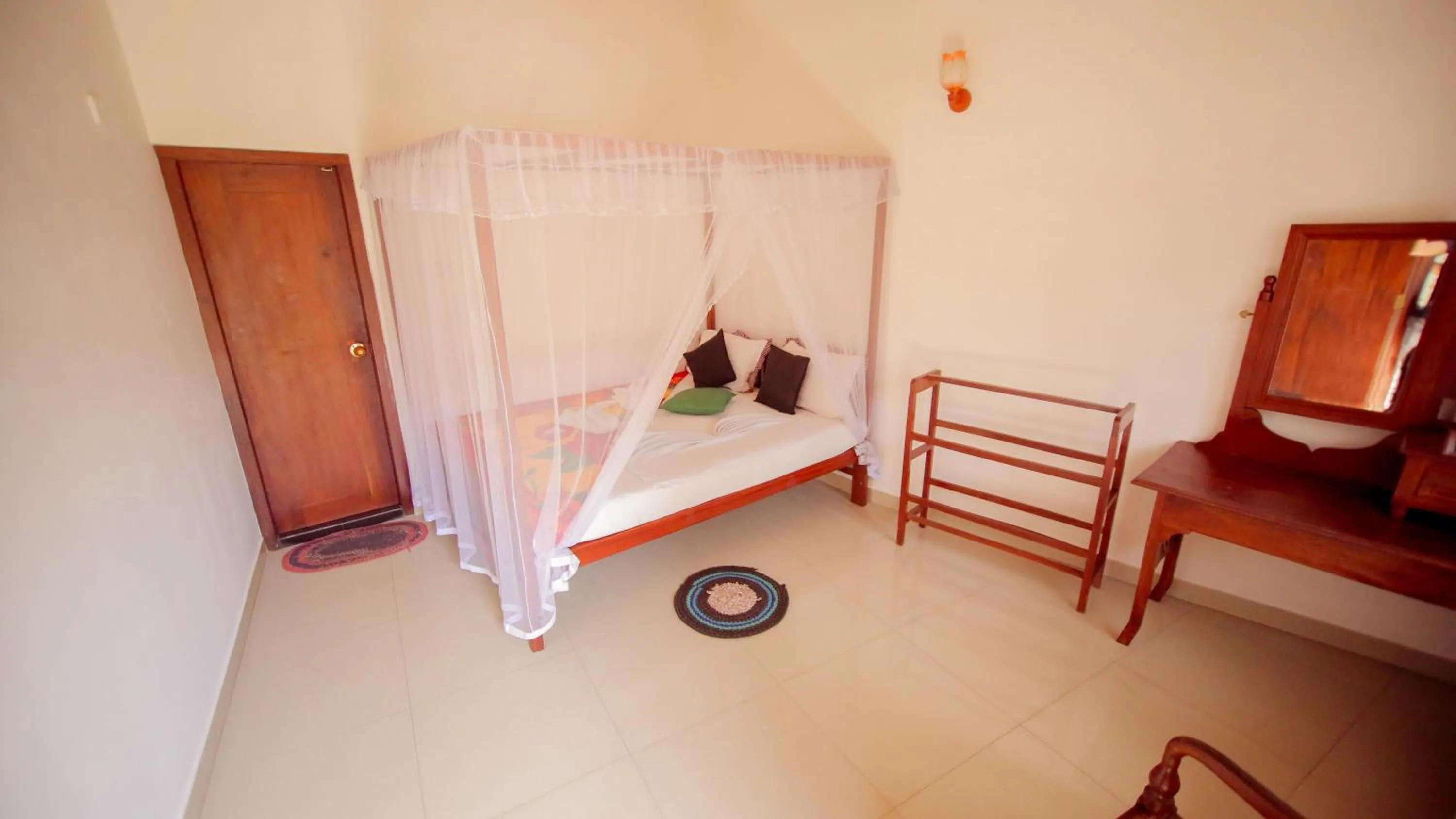Bedroom in The Frangipani motel