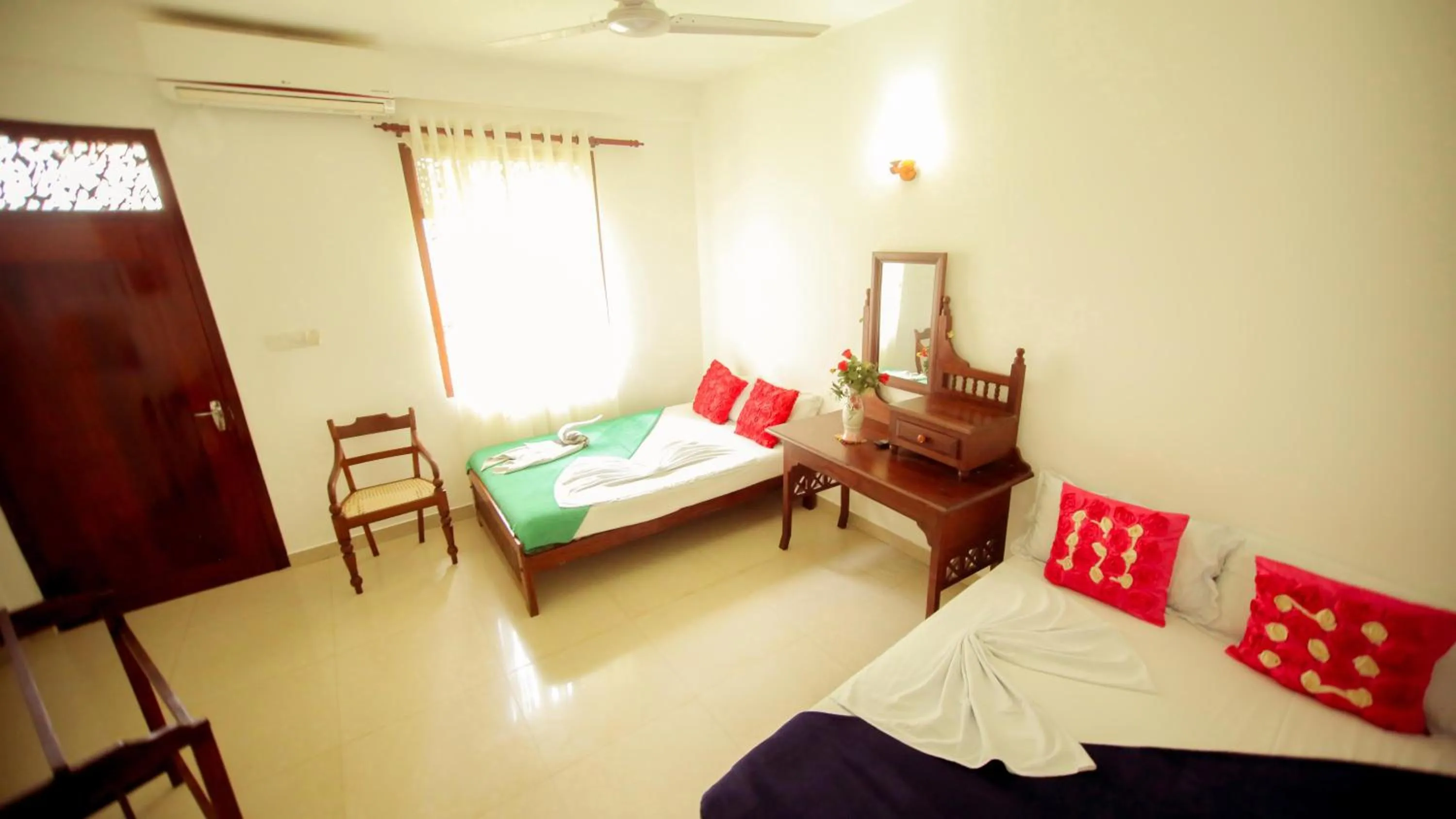 Bedroom in The Frangipani motel