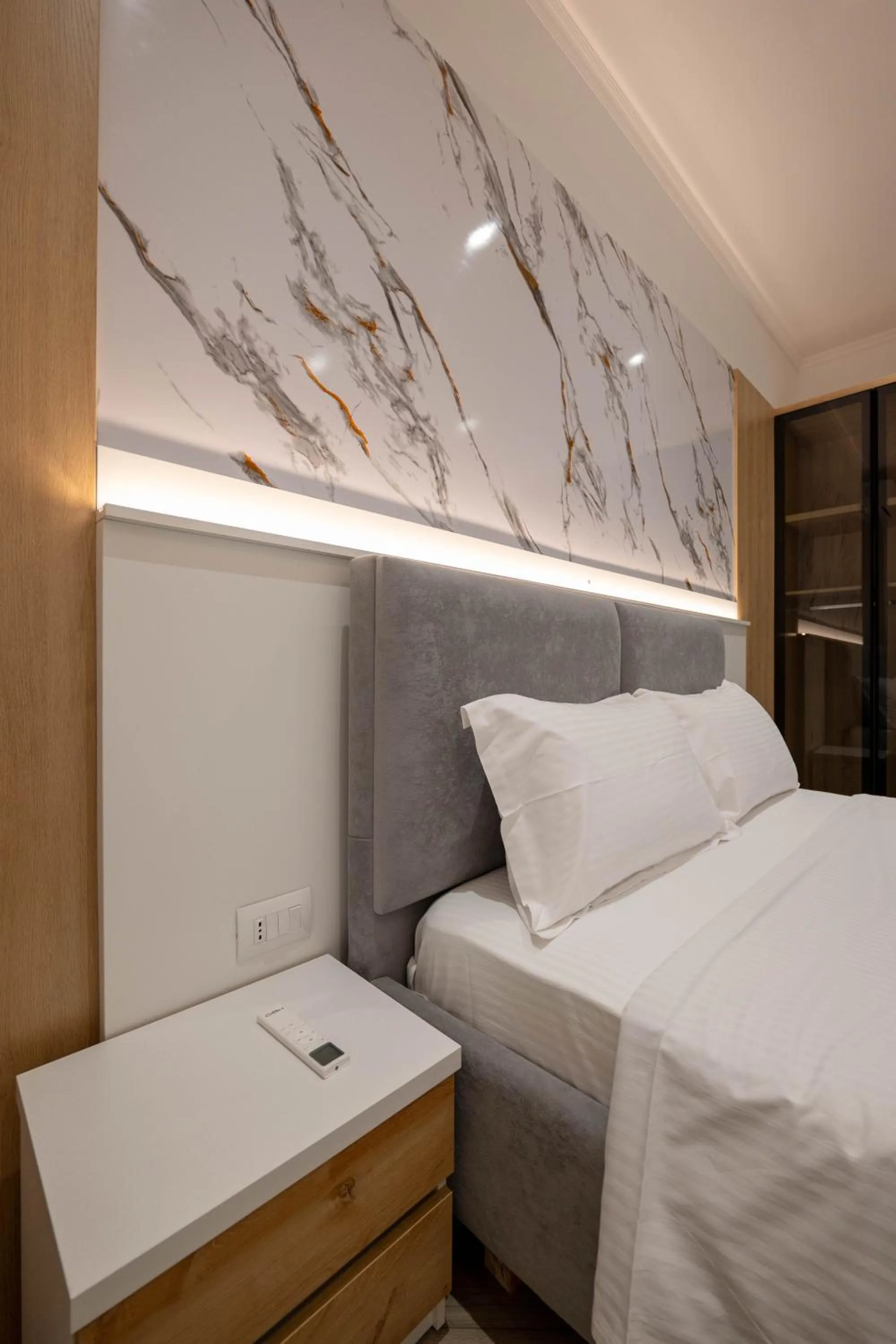 Bed in Regal Luxury Apartments