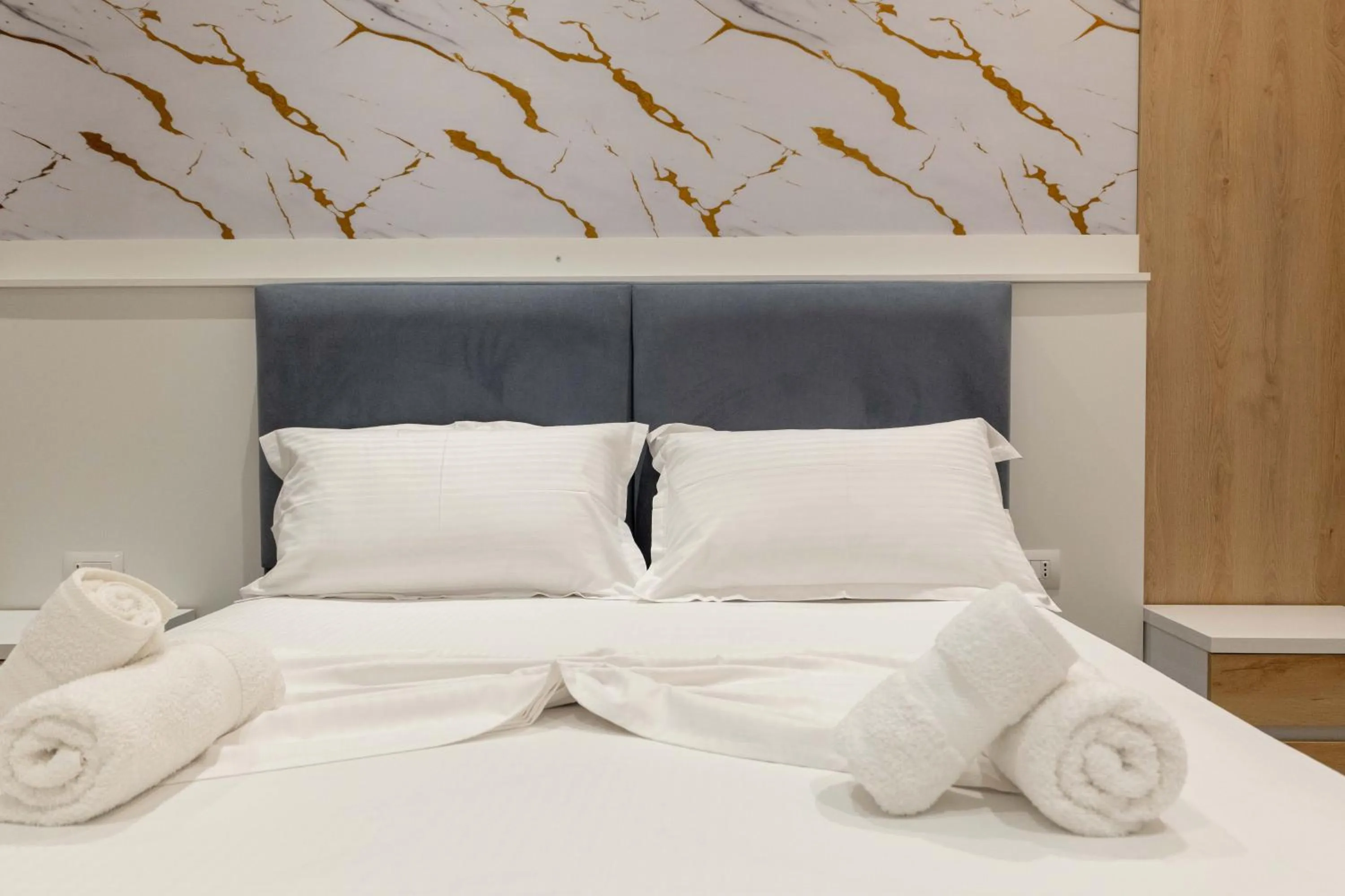 Bed in Regal Luxury Apartments