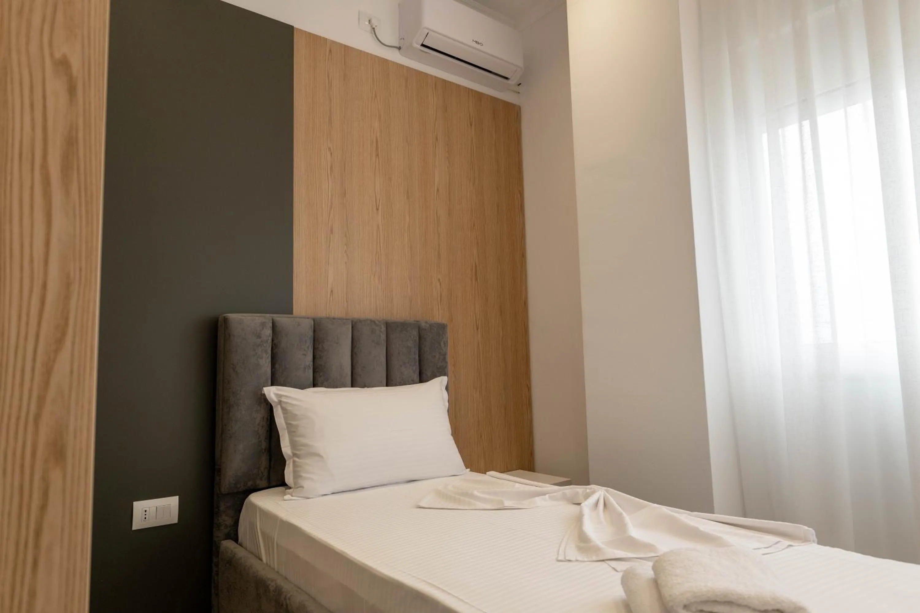 Bed in Regal Luxury Apartments