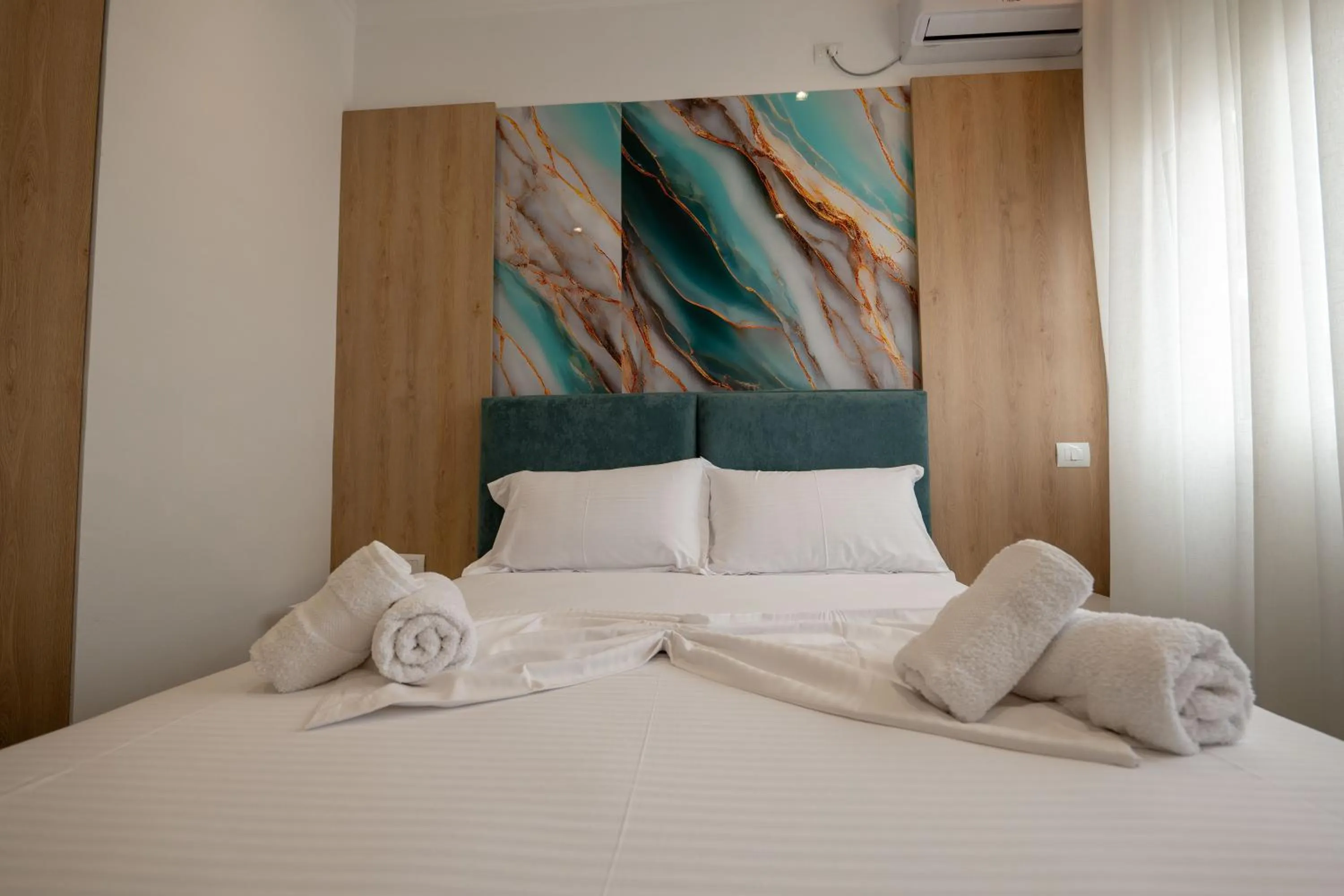 Bed in Regal Luxury Apartments