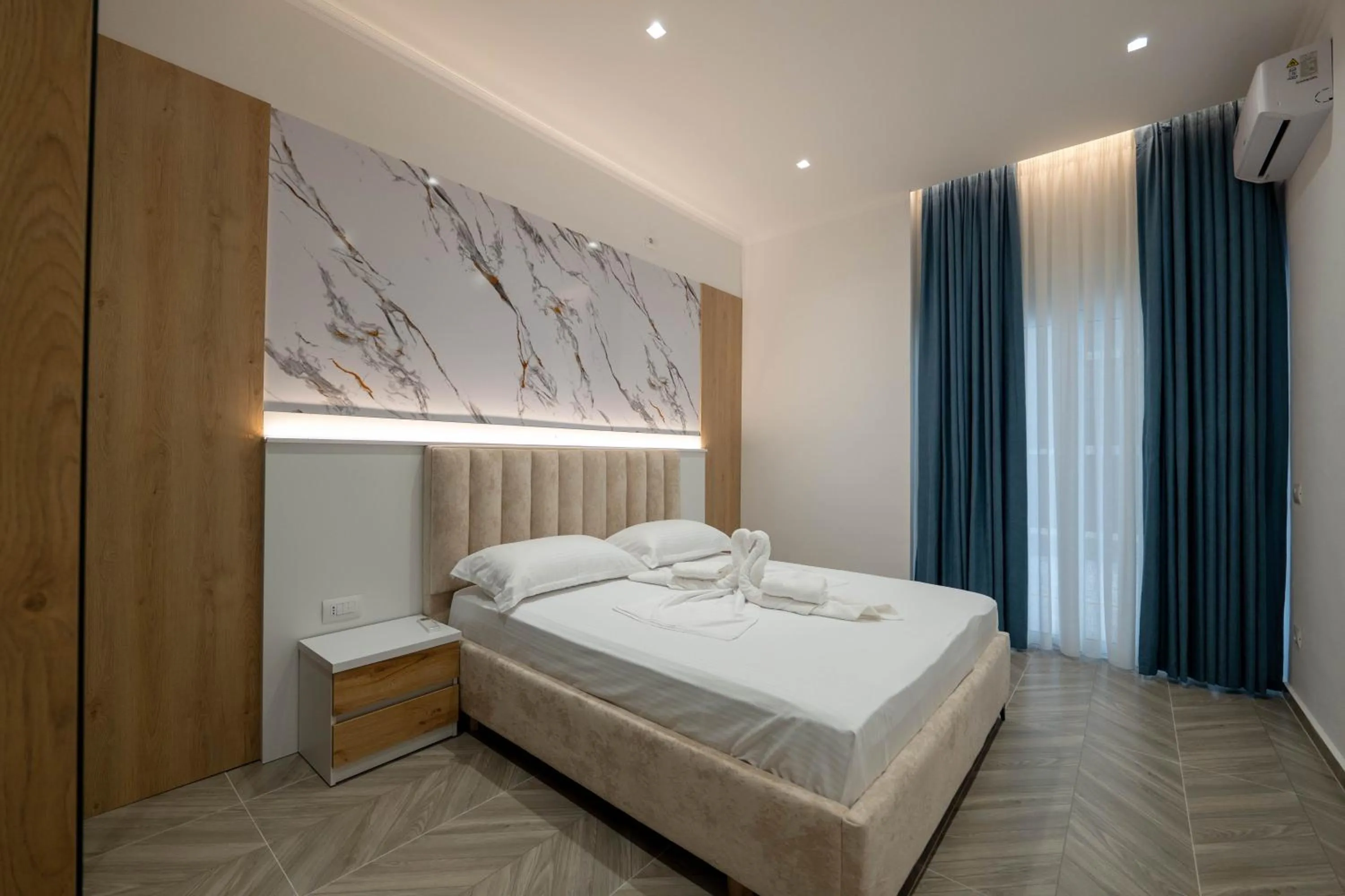 Bed in Regal Luxury Apartments