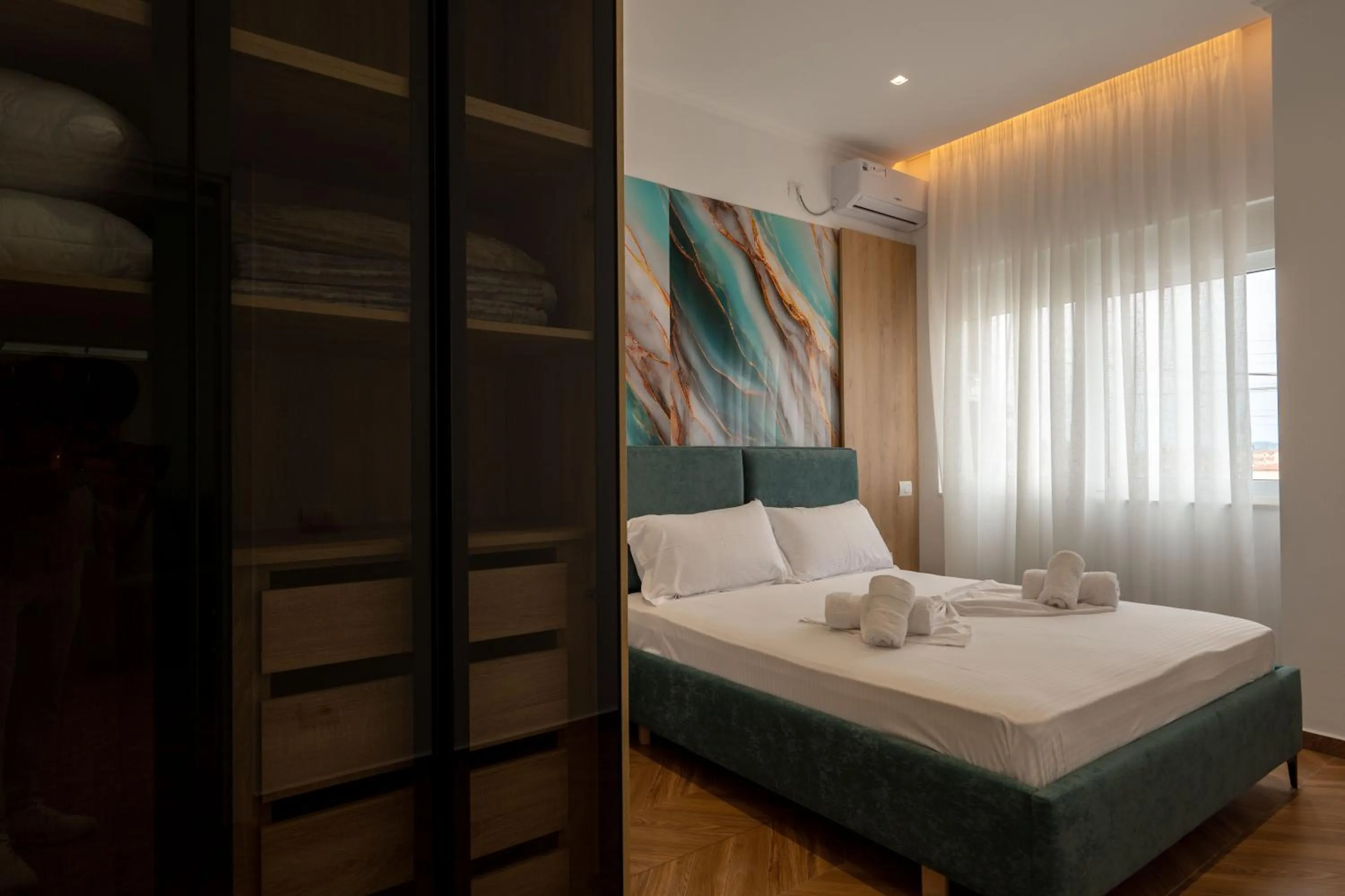Bed in Regal Luxury Apartments