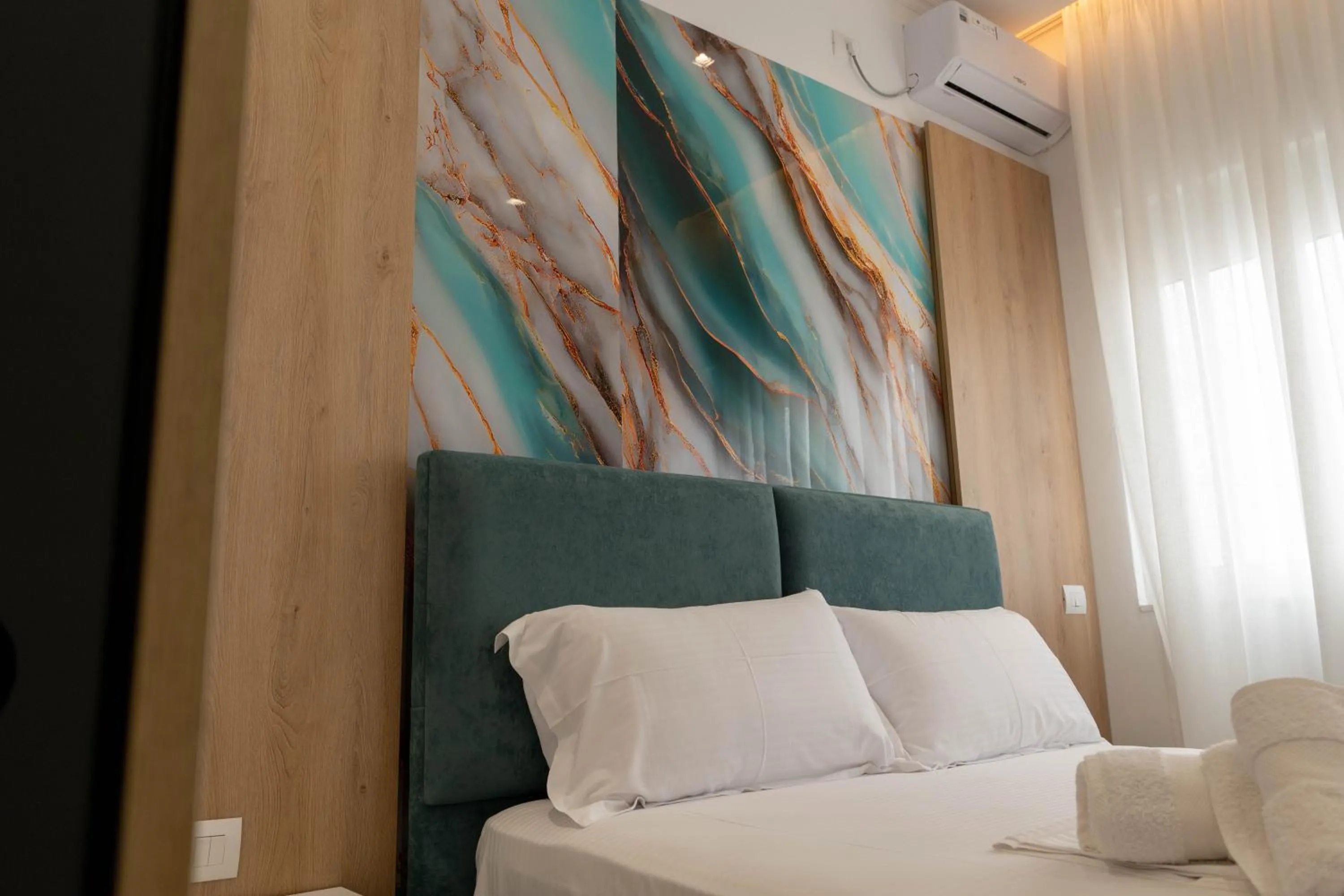 Bed in Regal Luxury Apartments