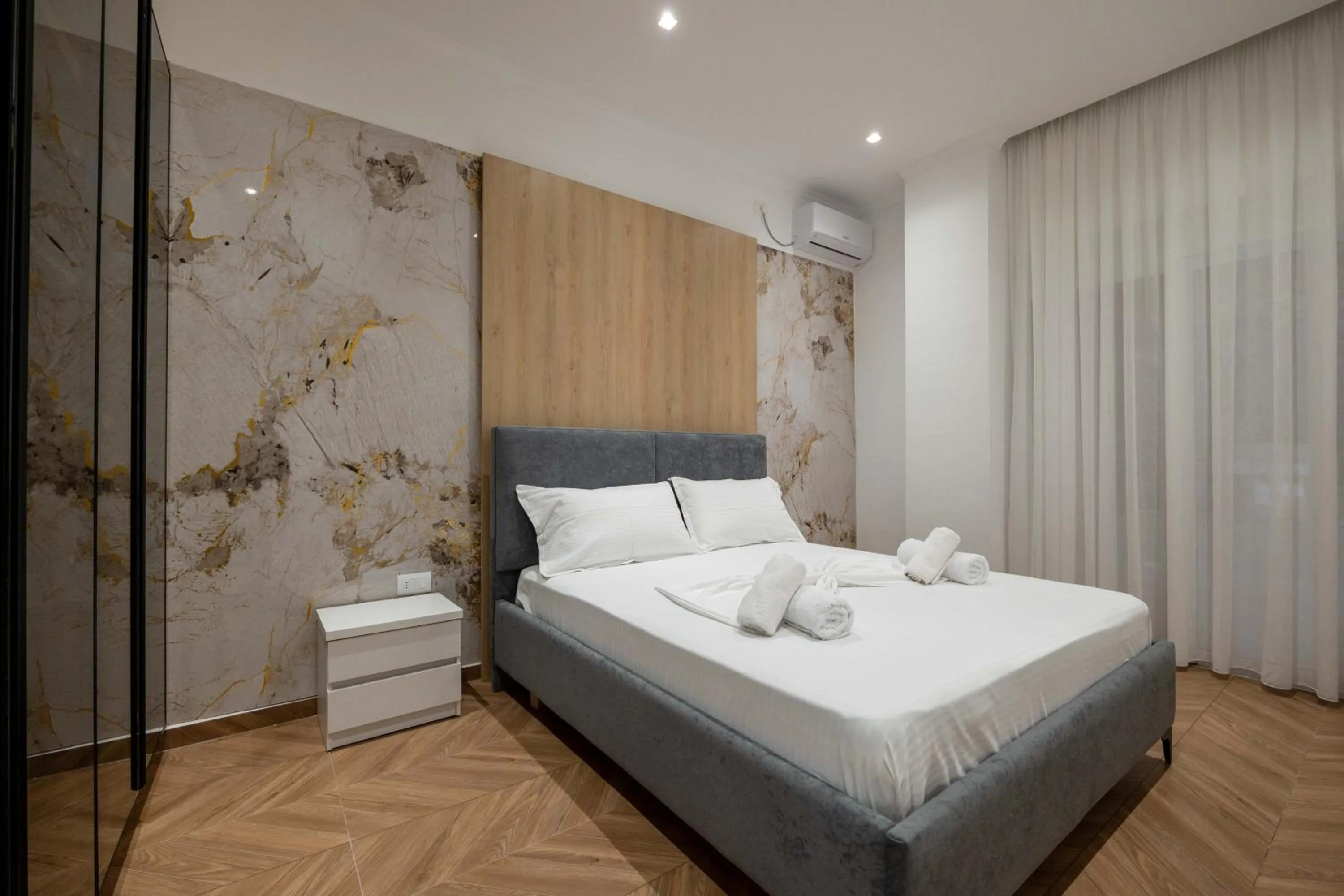 Bed in Regal Luxury Apartments