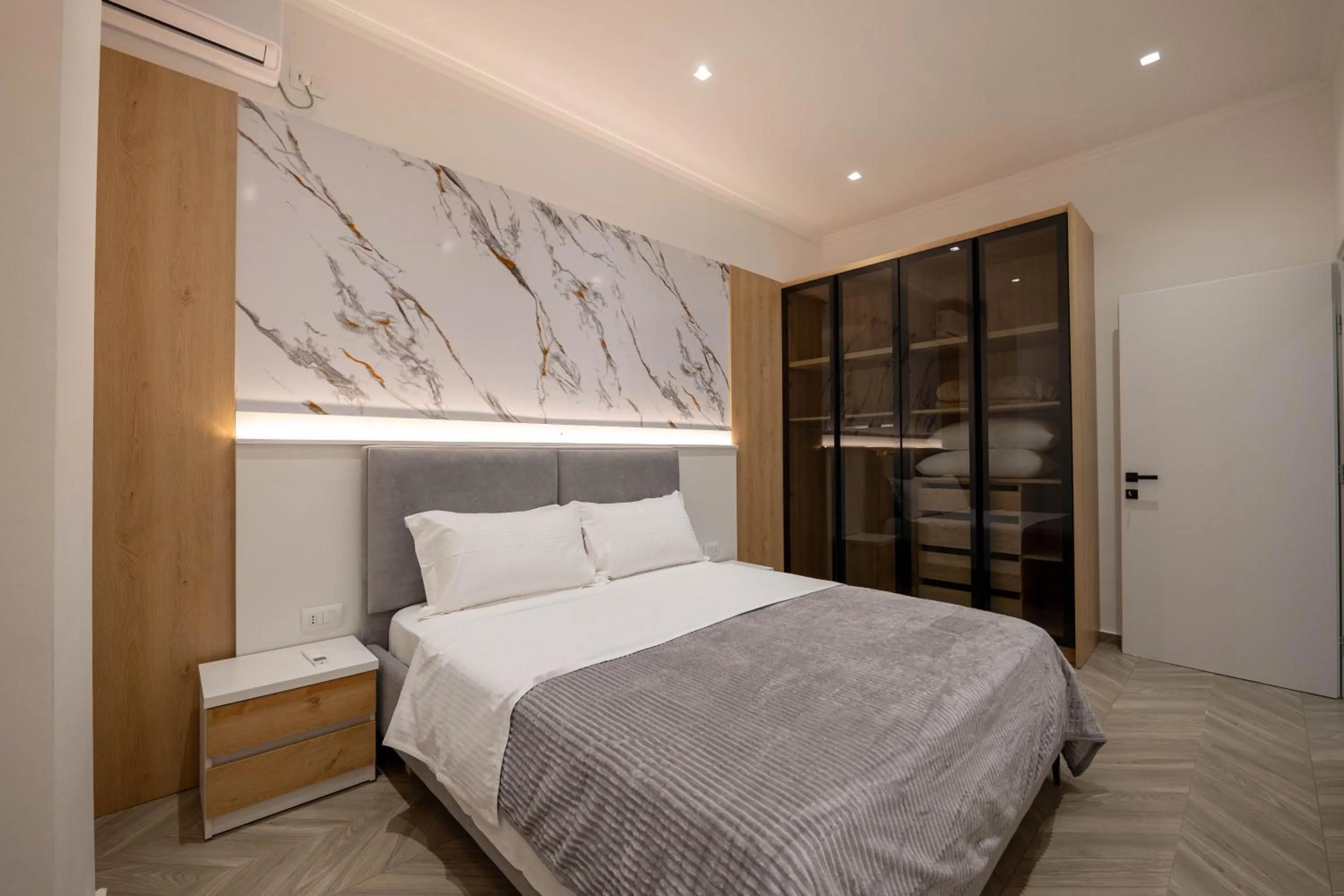 Bed in Regal Luxury Apartments