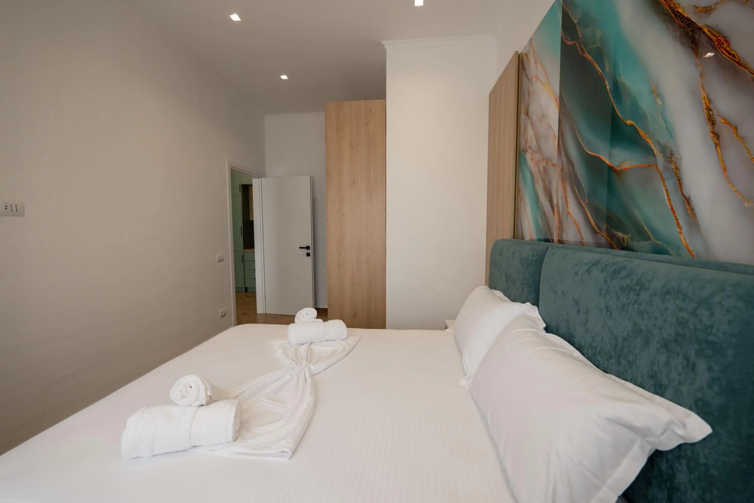 Bed in Regal Luxury Apartments